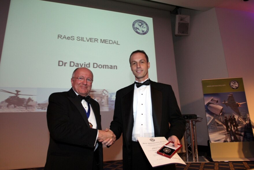 AFRL’s Dr. David Doman accepts the Royal Aeronautical Society (RAeS) Silver Medal for advances in controls-based hypersonic vehicle modeling (photo courtesy of RAeS).