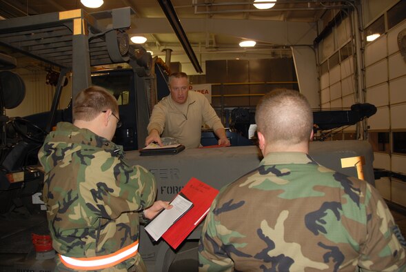 Senior Master Sgt. Wade Zinsmeister prepares Kentucky Air National Guard members to deploy to Hardinsburg, Ky.,  for a storm-relief mission.  The Kentucky Air National Guard deployed 173 Airmen to Hardinsburg this morning as part of statewide efforts to assist more than 500,000 Kentuckians who have been left without power following last week’s devastating winter storms.  (Photo by Tech. Sgt. Dennis Flora / KyANG)