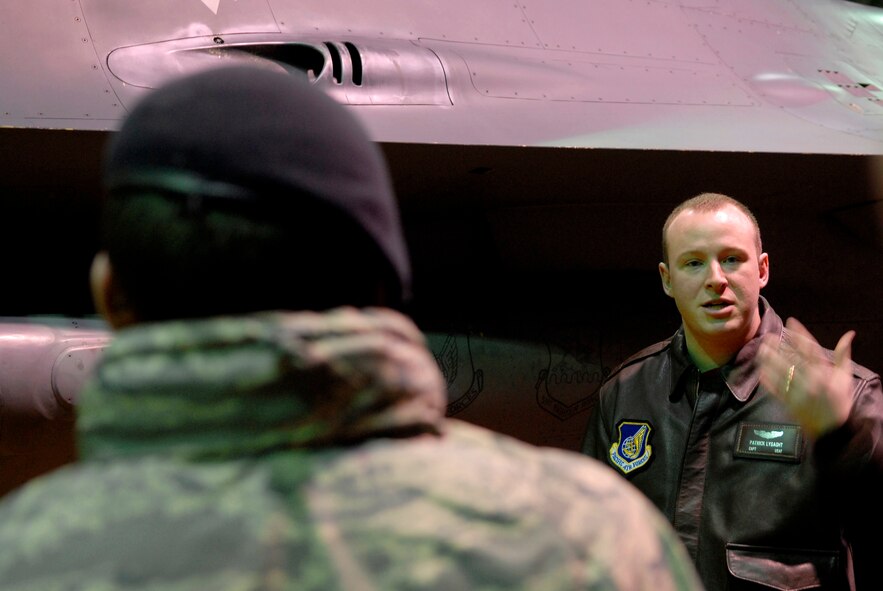 Captain Patrick Lysaght explains the capabilities of the F-16 Falcon to a group of 51st Security Forces Squadron Airmen Jan. 23 at Osan AB. The tour was part of an open house hosted by the 36th Fighter Squadron that is designed to give Airmen across the base an opportunity to learn more about the squadrons they support. Captain Lysaght is assigned to the 36 FS at Osan AB. (U.S. Air Force photo/Staff Sgt. Brian Ferguson)