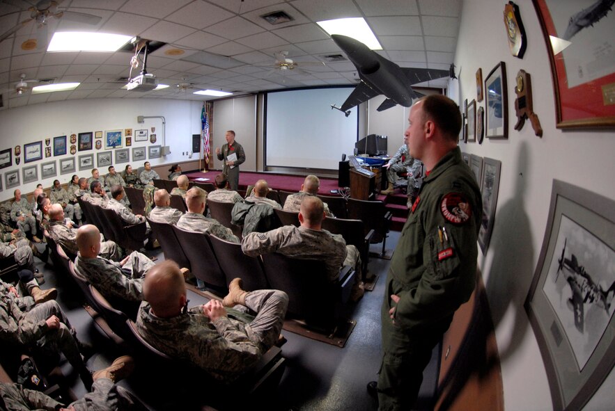 Lt. Col. Robert Swaringen briefs a tour of 51st Security Forces Squadron Airmen on the mission of the 36th Fighter Squadron during an open house Jan. 23 at Osan AB.  The tour was part of an open house hosted by the 36th Fighter Squadron that is designed to give Airmen across the base an opportunity to learn more about the squadrons they support. Colonel Swaringen is the commander of the 36 FS at Osan AB. (U.S. Air Force photo/Staff Sgt. Brian Ferguson)