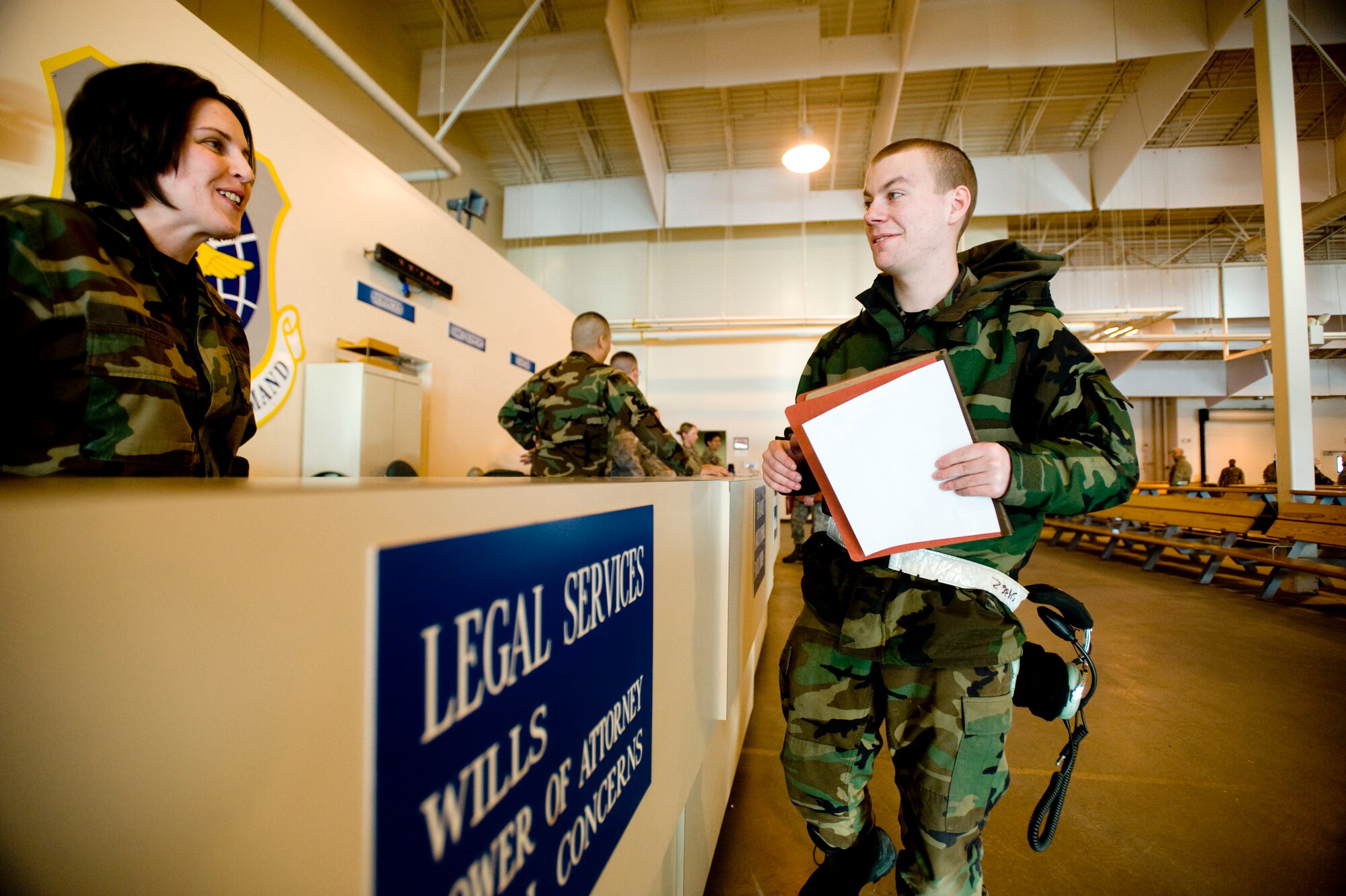 ELMENDORF AIR FORCE BASE, Alaska -- Capt. Constance Wilkes, 3rd Wing Legal, offers legal services to Airman 1st Class David Morris, 703rd Aircraft Maintenance Squadron, in preperation for his deployment to McChord Air Force Base Feb. 1, 2009. Five C-17 Globemaster IIIs and around 130 operations and maintenance personnel are heading to McChord AFB as a precautionary measure due to increased activity associated with Mount Redoubt. (U.S. Air Force photo/Senior Airman Jonathan Steffen)