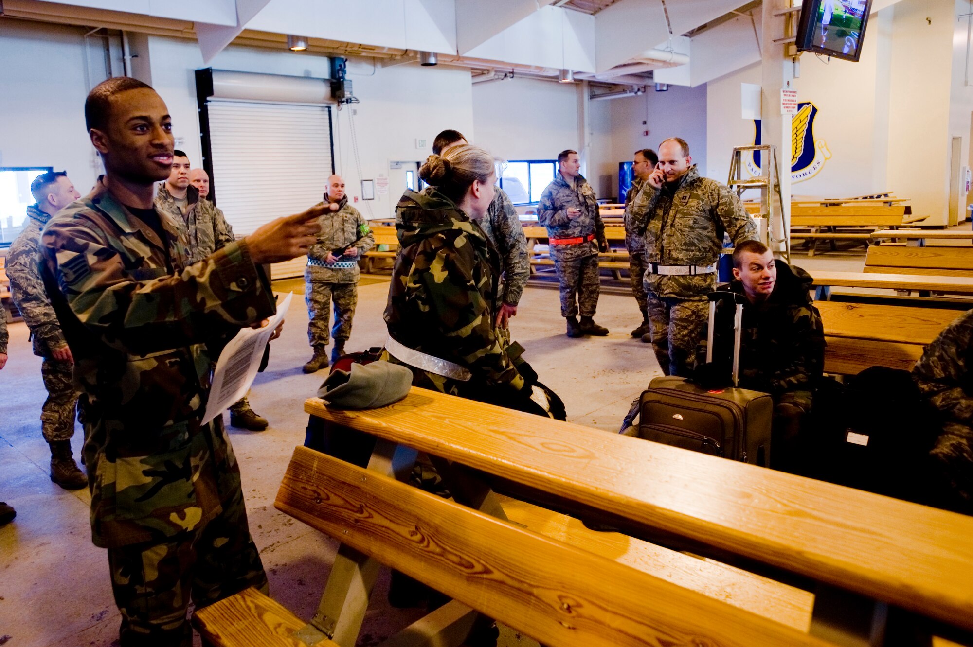 ELMENDORF AIR FORCE BASE, Alaska -- Staff Sgt. Marcus Wright, 3rd Mission Support Squadron, takes accountability of those heading to McChord Air Force Base Feb. 1, 2009. Five C-17 Globemaster IIIs and around 130 operations and maintenance personnel are heading to McChord AFB as a precautionary measure due to increased activity associated with Mount Redoubt. (U.S. Air Force photo/ Senior Airman Jonathan Steffen)