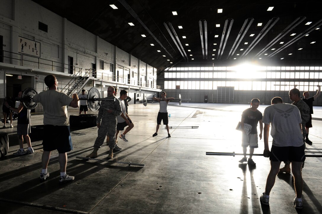 Ellsworth Airmen participate in Fight Gone Bad crossfit tournament here, Jan. 30. Twenty-Nine Airmen participated in wall ball, box jumps, deadlift high-pulls, push presses and row machine exercises in the competition. The goal of the tournament is to promote physical fitness amongst Ellsworth Airmen. (US Air Force photo/Airman 1st Class Corey Hook)