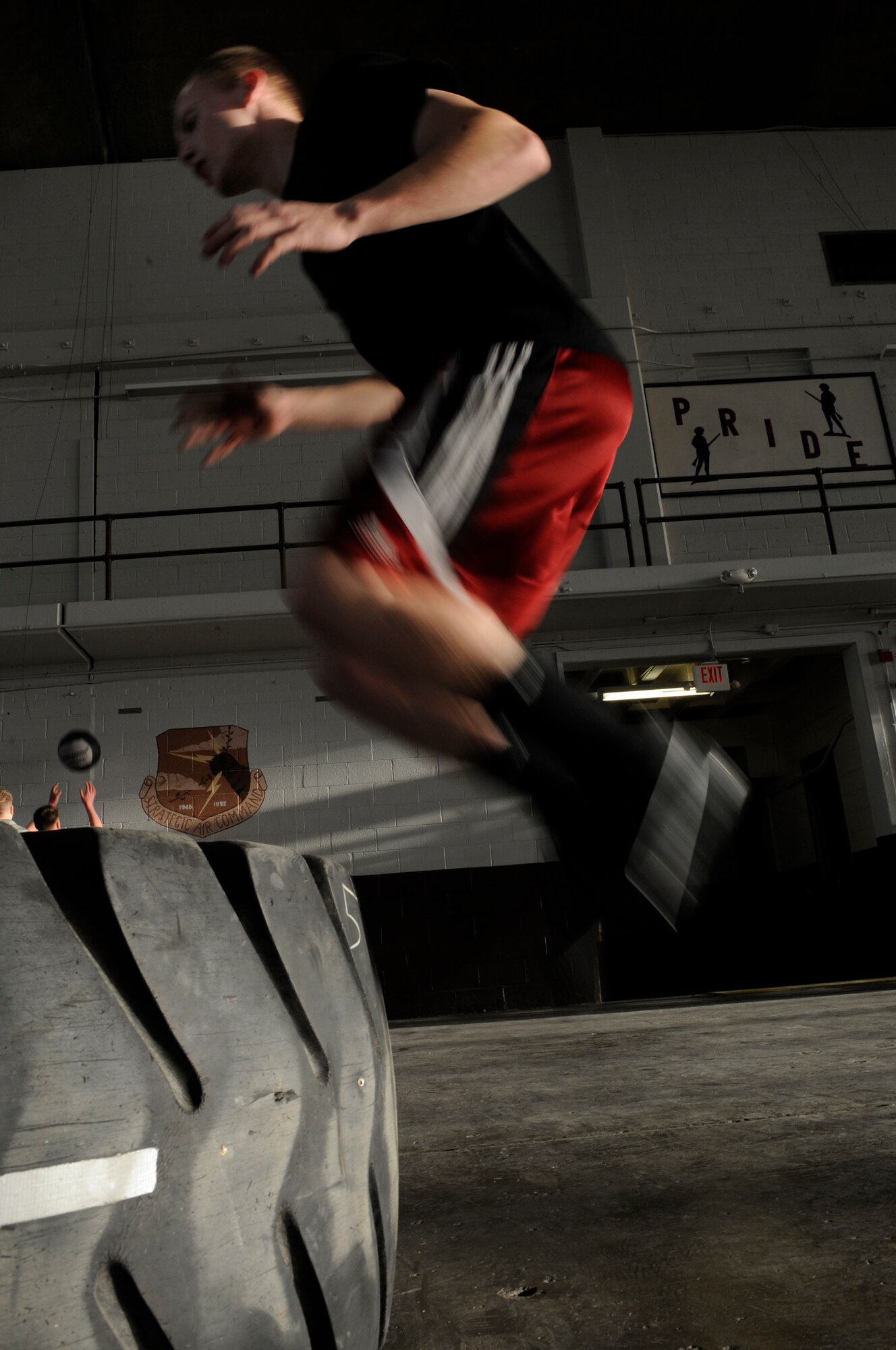 Airman 1st Class Sean Cramer, 28th Aerospace Maintenance Squadron offensive avionics systems apprentice, performs box jumps during Fight Gone Bad crossfit tournament here, Jan. 30. The Fight Gone Bad workout mimics mixed-martial arts training and consists of five exercises, performed for one minute each, with one-minute breaks given after all exercises have been completed. (US Air Force photo/Airman 1st Class Corey Hook)