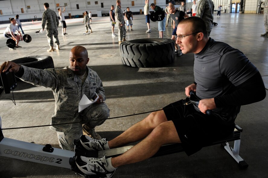 Airman 1st Class Robert Sirvid, 28th Civil Engineer Squadron pest management apprentice, exercises on a row machine during the Fight Gone Bad crossfit tournament here, Jan. 30. A1C Sirvid won the men’s category in the tournament with an overall score of 401 points. (US Air Force photo/Airman 1st Class Corey Hook)