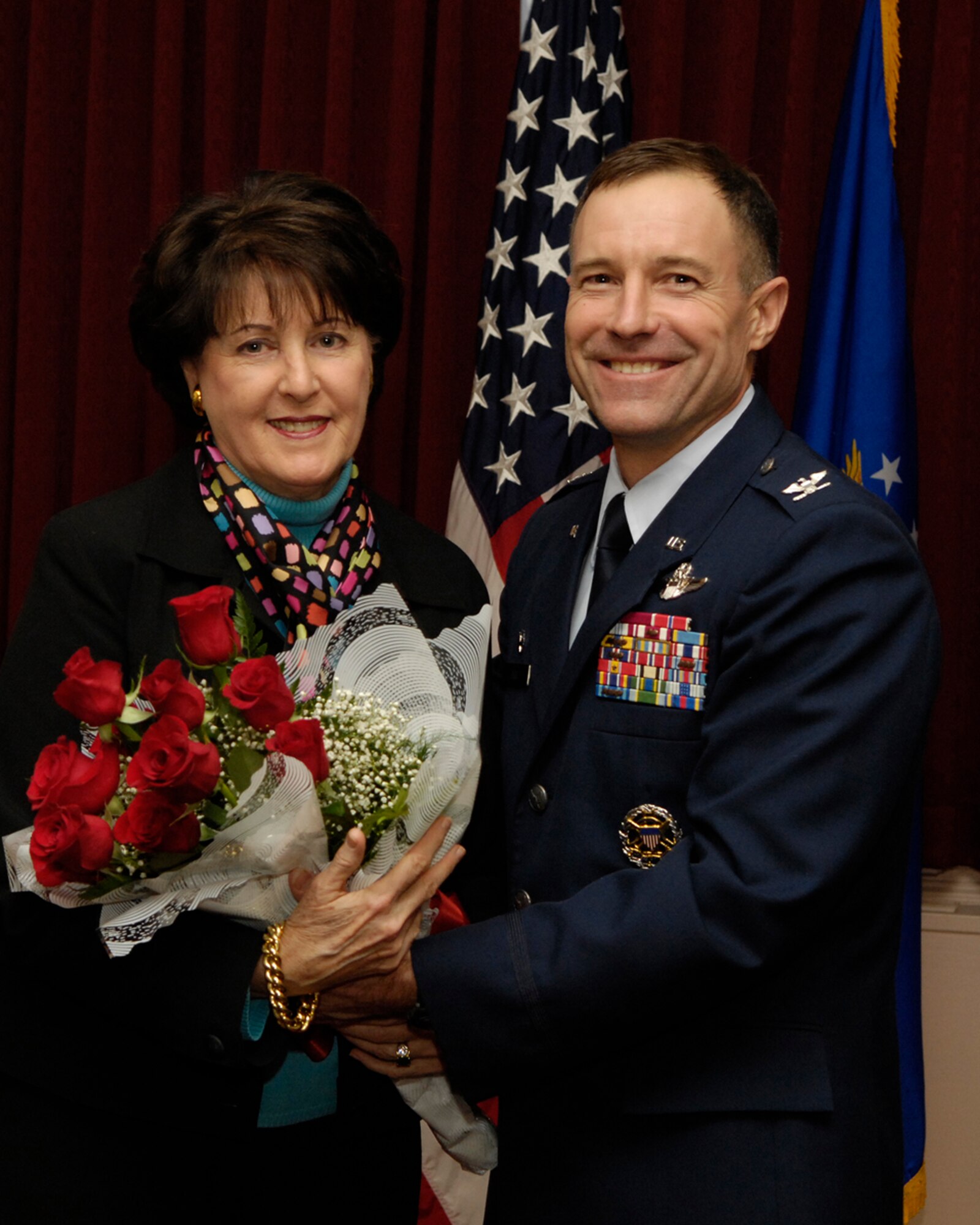 HANSCOM AIR FORCE BASE, Mass. - Col. David Orr, 66th Air Base Wing commander, welcomes Claire O'Connor into the Hanscom community as the Honorary Spouse for the 66 ABW during a ceremony at the Minuteman Club on Jan. 30. During the ceremony, Sara Mattes, Town of Lincoln selectman, was inducted as the 66 ABW vice commander and Maureen Sullivan, Bedford Chamber of Commerce executive director was inducted as Honorary Commander to the 66th Mission Support Group commander.  