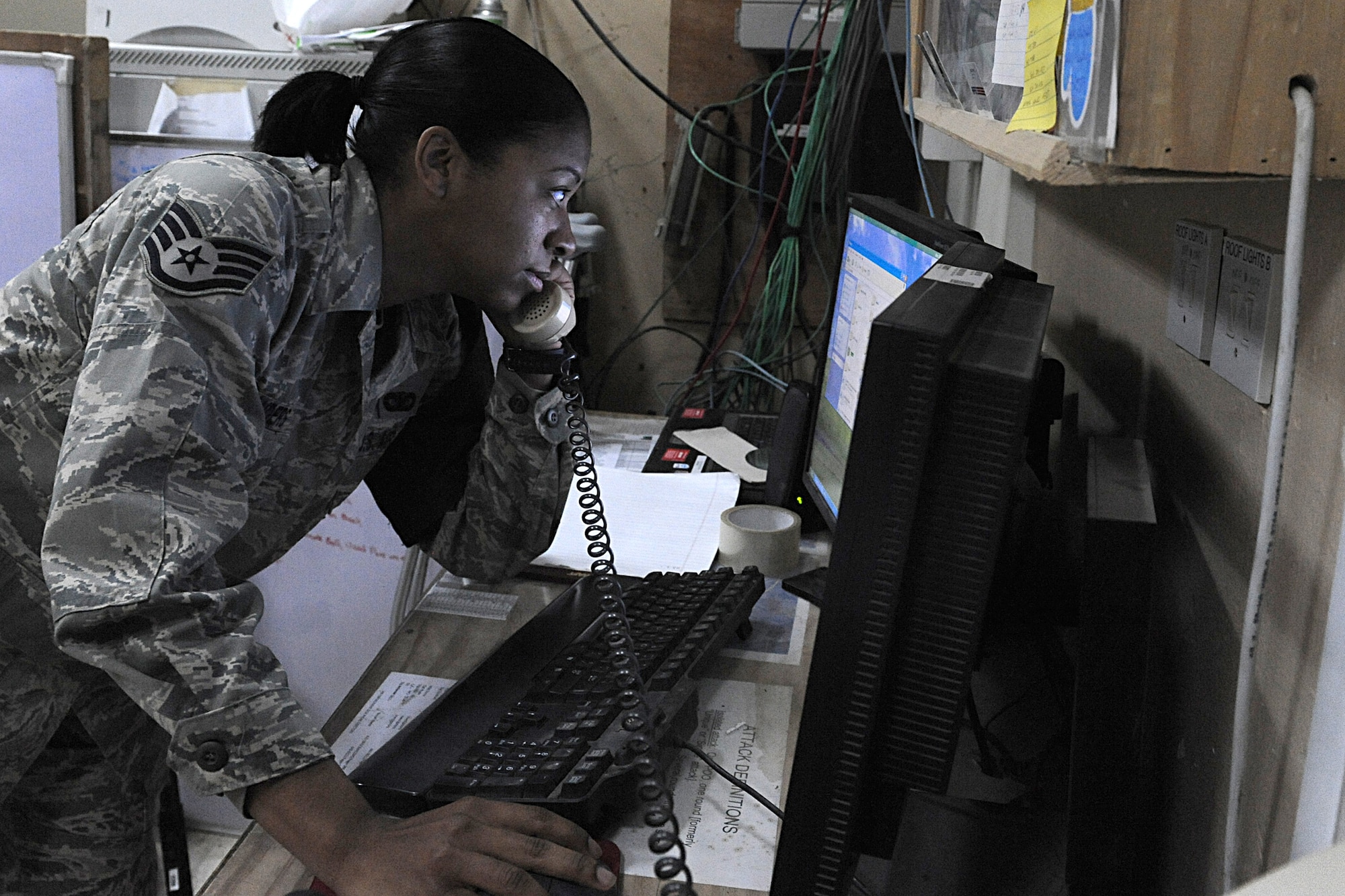 JOINT BASE BALAD, Iraq -- Staff Sgt. Jessica Sanders, a security forces leader with the 332nd Expeditionary Security Forces Squadron, assists the Joint Defense Operations Center, here, Feb. 2. Deployed from Moody Air Force Base, Ga., Sanders has completed three credit hours in college algebra through the College Level Examination Program and was selected for the Jan. 19-25 Tuskegee Airman of the week. (U.S. Air Force photo/Senior Airman Tiffany Trojca)