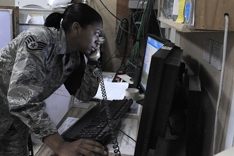 JOINT BASE BALAD, Iraq -- Staff Sgt. Jessica Sanders, a security forces leader with the 332nd Expeditionary Security Forces Squadron, assists the Joint Defense Operations Center, here, Feb. 2. Deployed from Moody Air Force Base, Ga., Sanders has completed three credit hours in college algebra through the College Level Examination Program and was selected for the Jan. 19-25 Tuskegee Airman of the week. (U.S. Air Force photo/Senior Airman Tiffany Trojca)