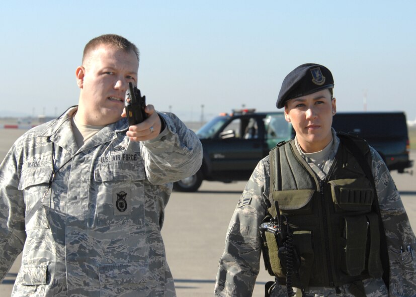 Master Sergeant Brian Wade (left) and Airman 1st Class Nicole Yarak participate in the Major Accident Response Exercise held at Travis Air Force Base on 13 January 2009.  The 60th Security Forces Squadron members were part of the Travis Security Team keeping unauthorized personal out of the secured area of the exercise.  (U.S. Air Force photo by Civ/Nan Wylie) 