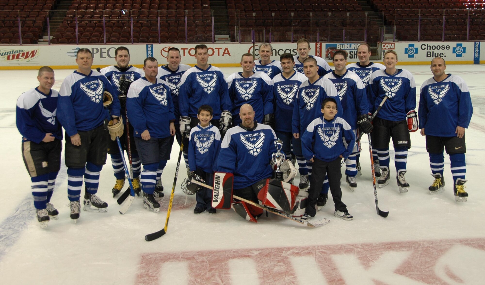 MCGUIRE AIR FORCE BASE, N.J. -- McGuire Air Force Base All-Stars take home the trophy Jan. 31 in a 7-1 win against Delaware's Dover Air Force Base All-Stars. The teams pitted skills in their second annual charity ice hockey match played at the Wachovia Spectrum in Philadelphia, Pa. The Combined Federal Campaign and Air Force Assistance Fund will share in the game's proceeds totalling $1,700. (U.S. Air Force photo/Master Sgt. Donna T. Jeffries)
