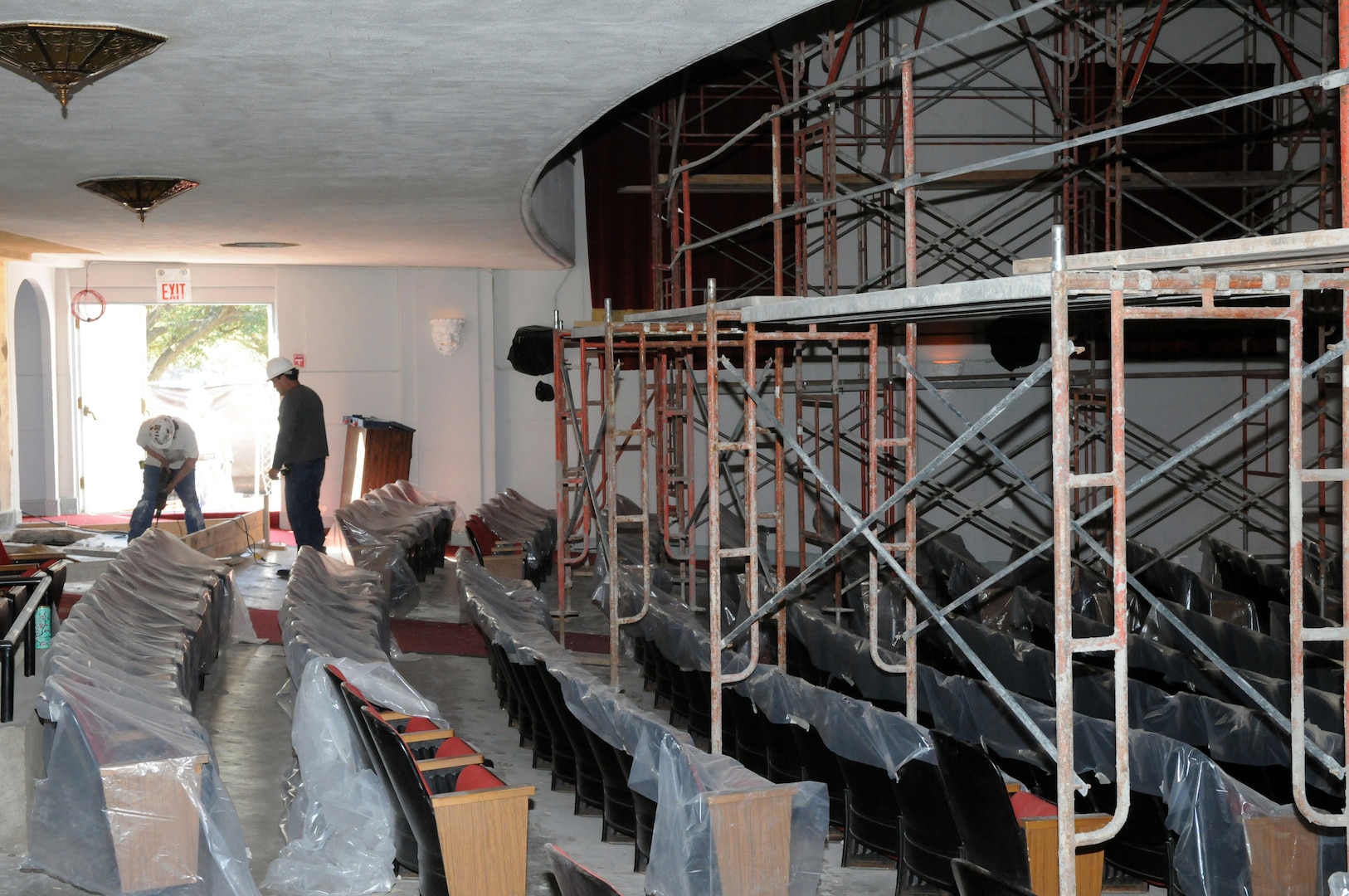 Contractors work on scaffolding for the base theater renovation project on Jan. 29. (U.S. Air Force photo by Rich McFadden)