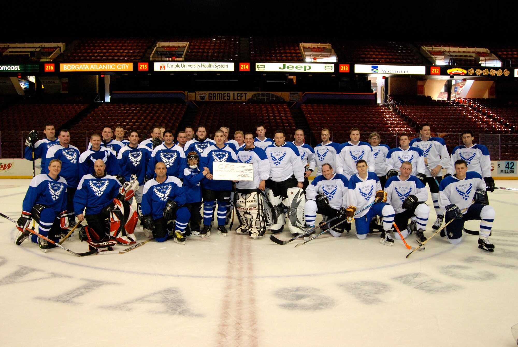 PHILADELPHIA, Pa. -- Members of Dover Air Force Base and McGuire Air Force Base hockey teams raised $1,700 for the Combined Federal Campaign in the second annual charity hockey match in Philadelphia Jan. 31. The game, held prior to the Philadelphia Phantoms match, ended with a 1-7 loss for Dover. Dover's team was comprised of active-duty, reservists and civilians from the 436th and 512th Airlift Wings. (U.S. Air Force photo/Staff Sgt. Steve Lewis) 