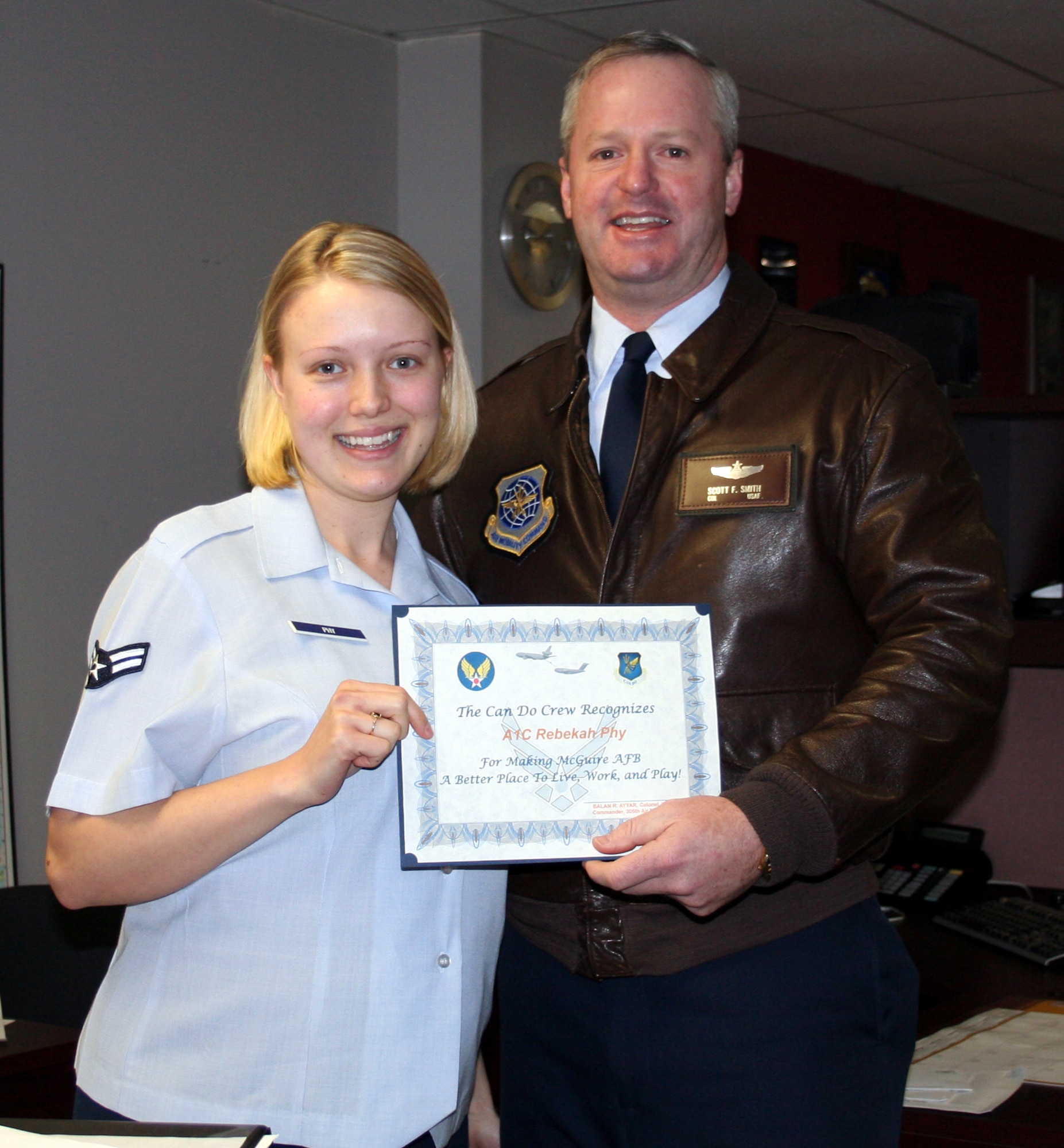 Right, Col. Scott Smith, 305th Air Mobility Wing vice commander, presents a Can Do Crew award to Airman 1st Class Bekah Phy, 305th AMW public affairs editor. “Airman Phy makes sure the McGuire community receives necessary news information and announcements through journalism and mass communication, and diligently informs our installations with pride, accuracy and dedication. She is always willing to assist others by giving advice on what to submit for both the McGuire public Web site and Warrior Spirit newspaper. Airman Phy shows great attitude toward others, works extra hours to deliver the news in a timely manner and consistently demonstrates the Air Force core values. As of now, she literary runs the base paper single handedly.”

Be aware that the "Can Do Crew" is everywhere, looking for outstanding service.  They covertly seek members of Team McGuire who make a difference, identifying and recognizing only the best! Remember, the strongest asset of Team McGuire is its people; you are what makes McGuire a better place to live, work and play!
