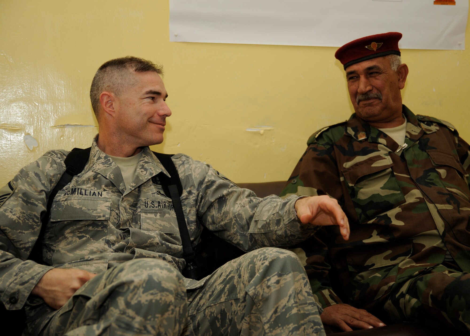 Master Sgt. Shawn McMillian, senior enlisted advisor for the Coalition Army Advisory Training Team, talks with Iraqi army Sgt. Maj. Hannoon Saskbor Arian al Taai, Taji at Taji Military Base, Iraq, Nov. 23, 2008. Sergeant McMillian is the enlisted advisor to Hannoon. (U.S. Air Force Photo/Staff Sgt. Paul Villanueva II)