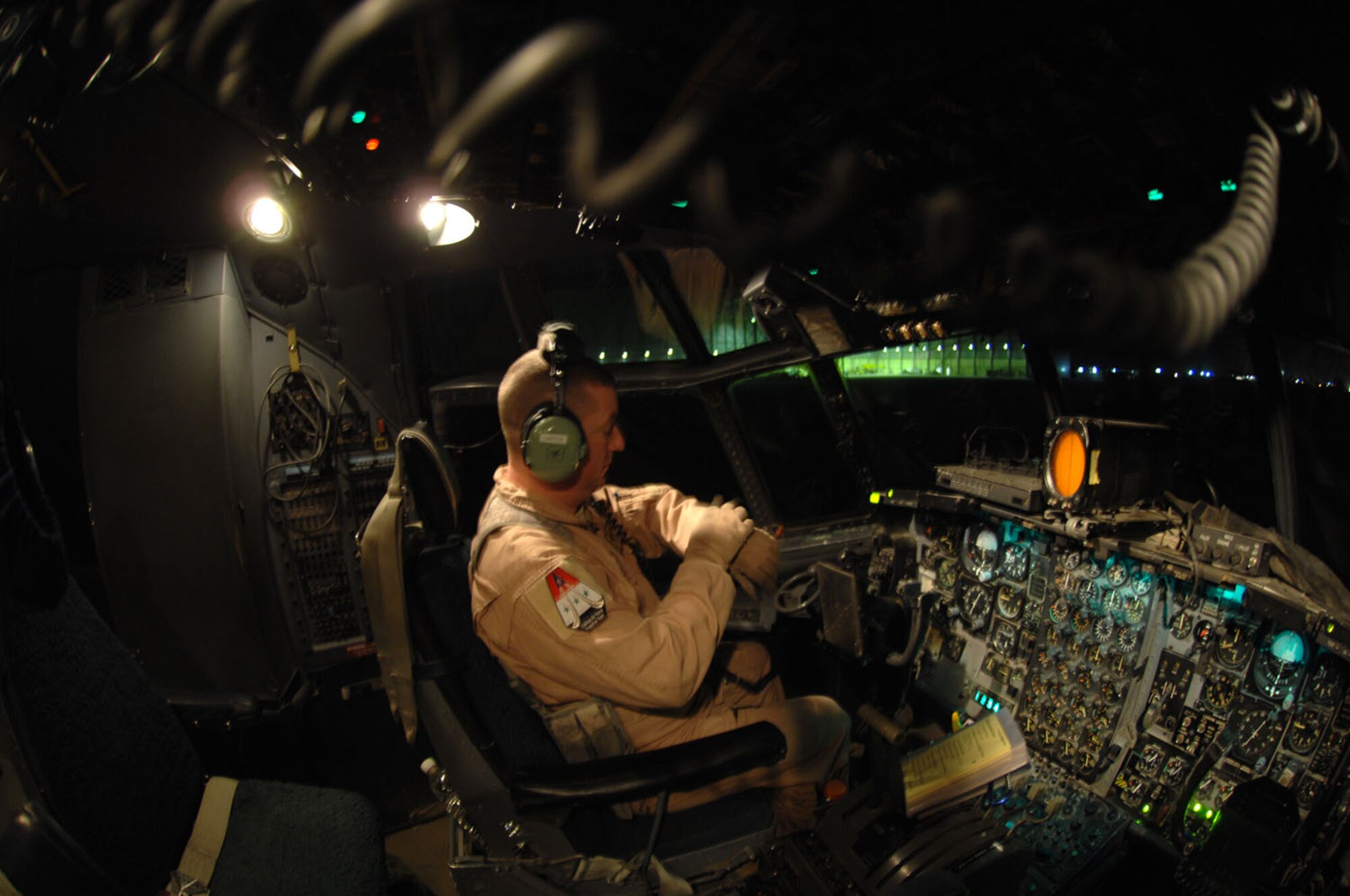Master Sgt. Louis Carter, 321st Air Expeditionary Airlift Squadron combat aviation advisor, stands on the steps of an Iraqi C-130E after completing a pre-flight inspection here Feb.2. The C-130 was one of two aircraft on its way to pick up Iraqi election ballot boxes. Sergeant Carter is deployed from the 550th Special Operations Squadron at Kirtland Air Force Base, N.M. (U.S. Air force photo by Staff Sgt. Tim Beckham)