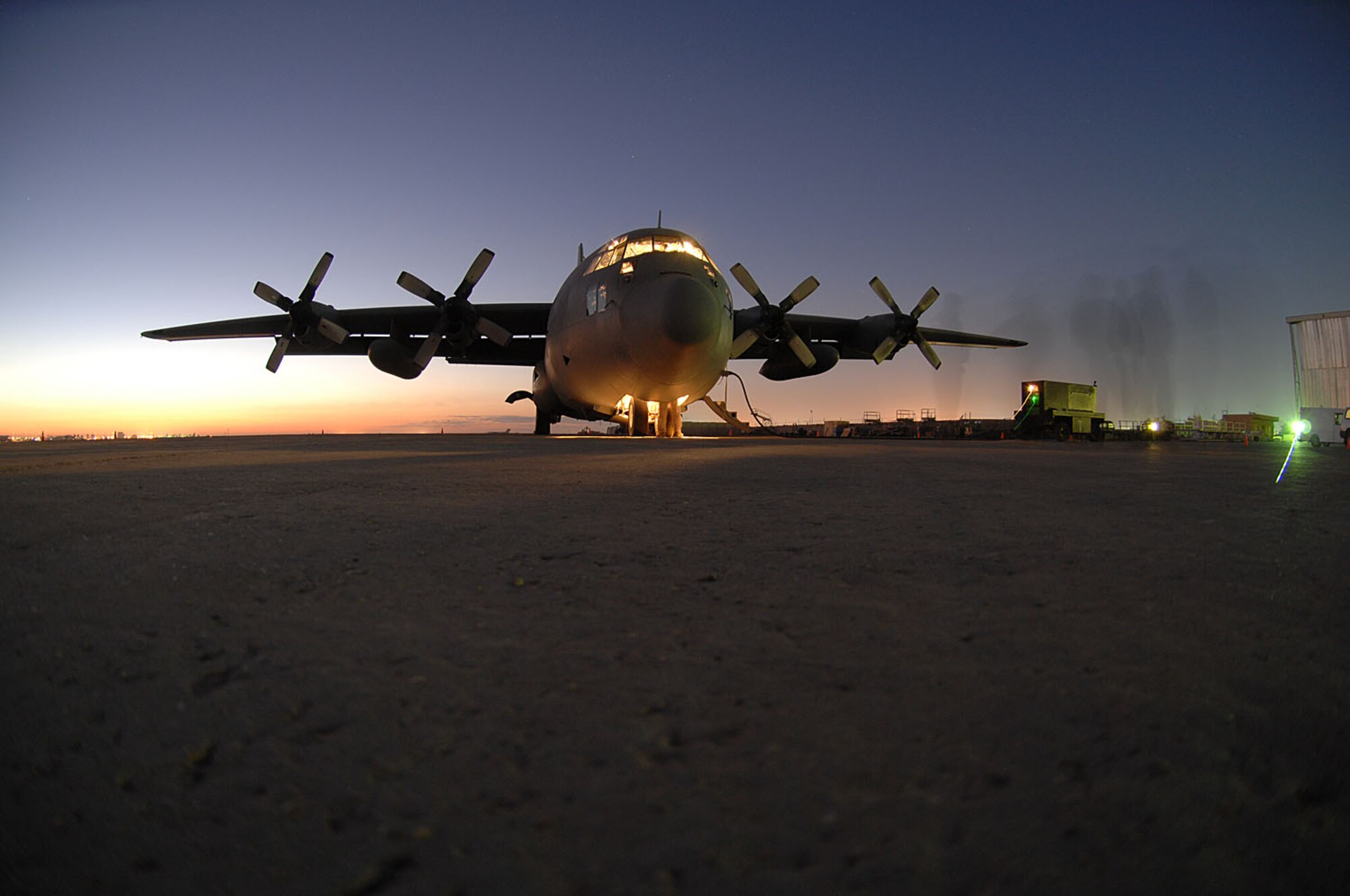 Master Sgt. Louis Carter, 321st Air Expeditionary Airlift Squadron combat aviation advisor, performs a pre-flight inspection on an Iraqi C-130E here Feb.2. The C-130 was one of two aircraft on its way to pick up Iraqi election ballot boxes. Sergeant Carter is deployed from the 550th Special Operations Squadron at Kirtland Air Force Base, N.M. (U.S. Air force photo by Staff Sgt. Tim Beckham)