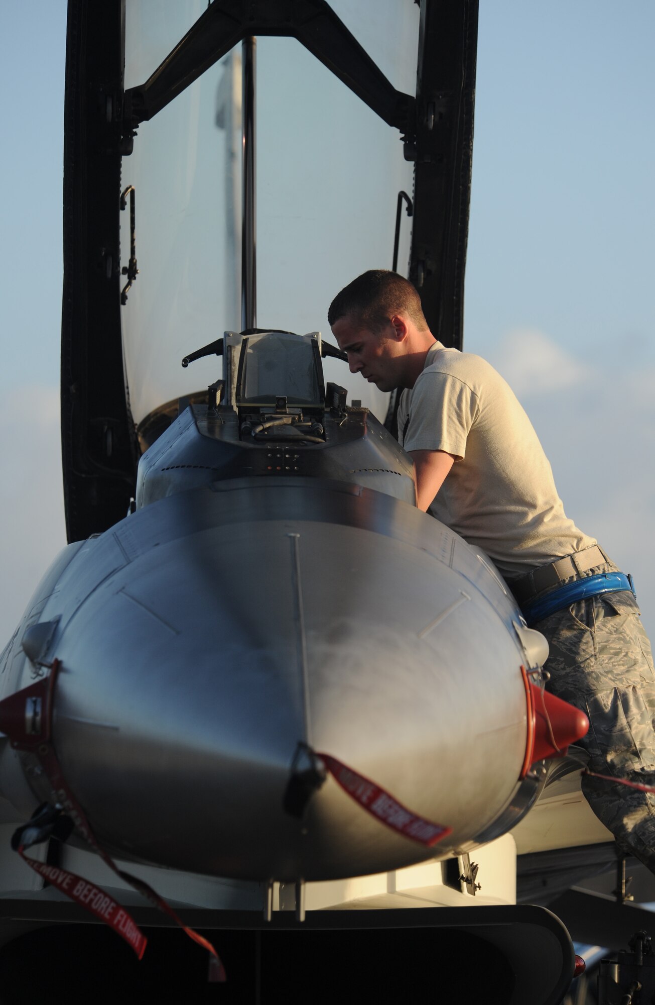 Airman First Class Colin Hunt, crew chief performs post flight maintenance on an F-16 Fighting Falcon, 18th Aggressor Squadron, Eielson Air Force Base, Alaska after landing Jan. 31, at Andersen AFB, Guam for exercise Cope North 09-1 from 2-13 Feb. The Cope North exercise is one of the longest-running series of exercises in the Pacific theater.  Since the first Cope North exercise in 1978, thousands of American and Japanese personnel have honed skills that are vital to maintaining a high level of readiness.  The exercise has been in the planning stages for several months and bears no connection to any real-world events.  This will be the tenth time the United States and Japan have held a Cope North exercise on Guam, and it will be the fourth time that the JASDF will use live ordnance. Airman Hunt is assigned to the 354th Aircraft Maintenance Squadron, Eielson AFB Alaska. 


(U.S. Air Force photo/ Master Sgt. Kevin J. Gruenwald) released

