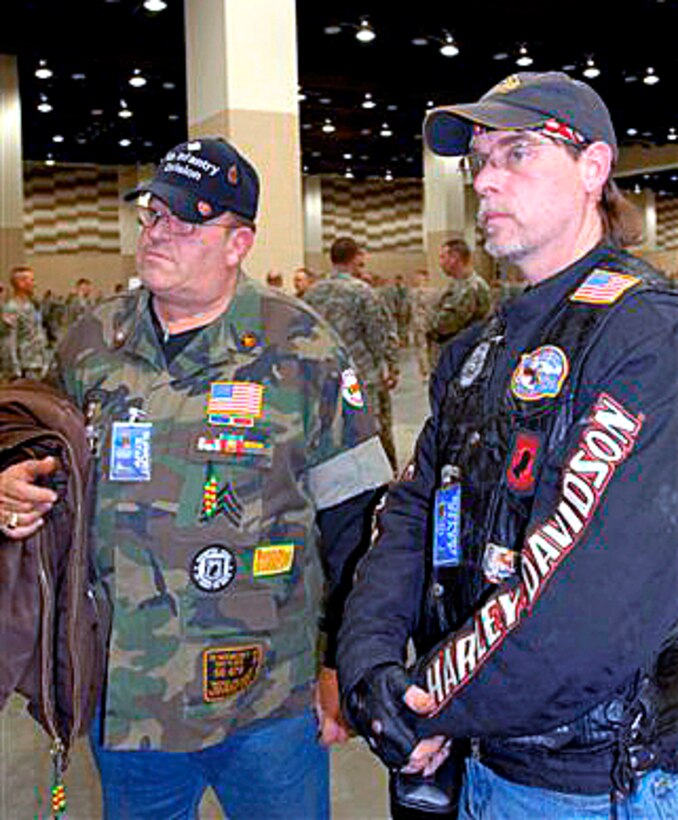 Lloyd Valentine and Damon Gastineau talk about their motivations for joining the Patriot Guard Riders during homecoming ceremonies for Indiana National guardsmen at Lucas Oil Stadium in Indianapolis, Jan. 31,2009. U.S. Army photo by Spc. Darren Salzer