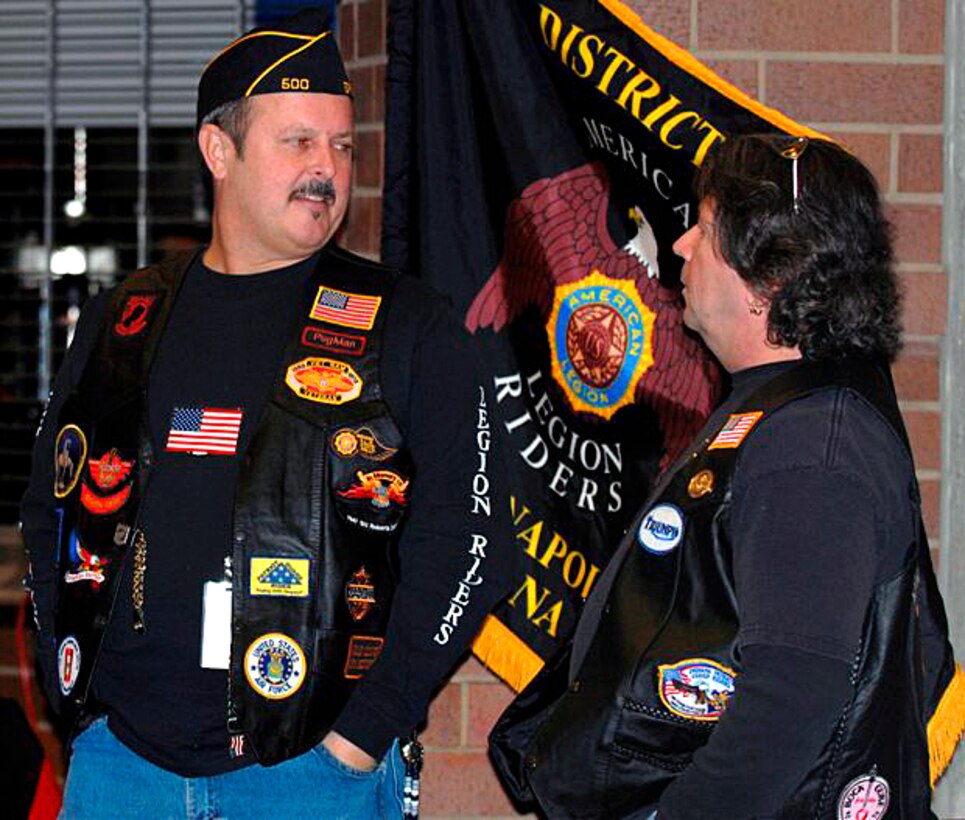 Leo Thompson and Bob Resnor, members of American Legion Riders, talk about events during homecoming ceremonies for Indiana National guardsmen at Lucas Oil Stadium in Indianapolis, Jan. 31, 2009.