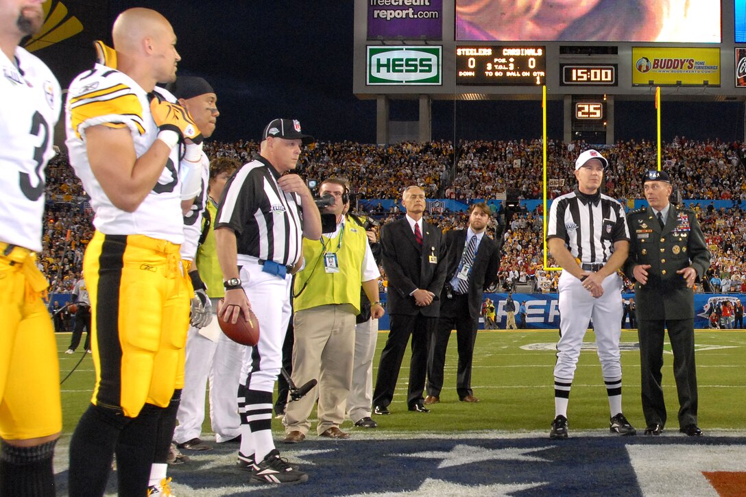 U.S. Army Gen. David H. Petraeus, commander, U.S. Central Command, talks with head Super Bowl XLIII Referee Terry McAulay prior to the coin toss, Feb. 1, 2009, at Raymond James Stadium in Tampa, Fla. 

