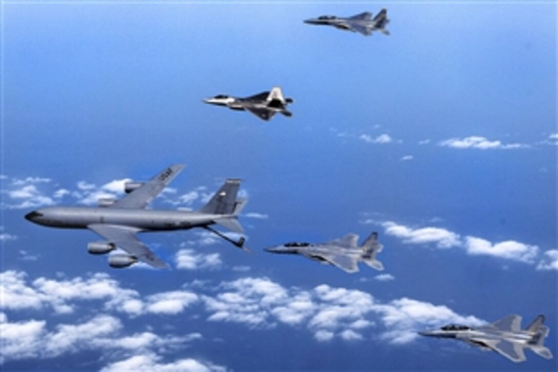 F-15 Eagles and an F-22 Raptor participate in an aerial refueling mission with a KC-135 Stratotanker from the 117th Air Refueling Wing in Birmingham, Ala., Jan. 23. 2009. The air crews and jets are assigned to the 325th Fighter Wing on Tyndall Air Force Base, Fla.