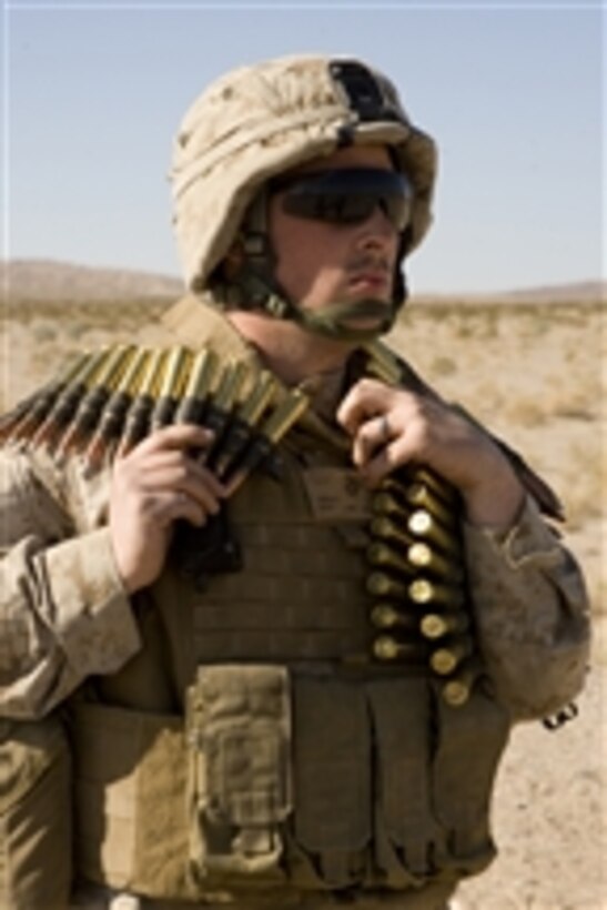 A U.S. Marine with 5th Battalion, 10th Marine Regiment, carries ammunition for an M-2 .50 caliber machine gun at Twentynine Palms, Calif., on Jan. 25, 2009.  Marines with the 5th Battalion are participating in Exercise Mojave Viper in preparation for their deployment to Afghanistan in support of Operation Enduring Freedom.  