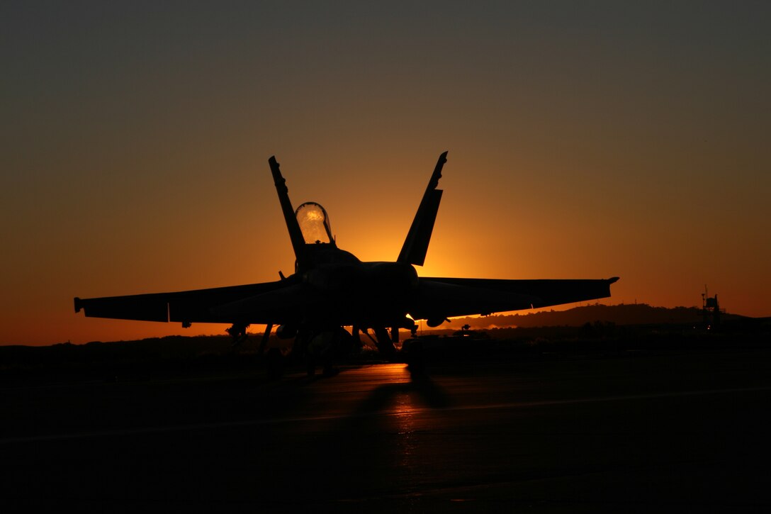 An F/A-18A ?Hornet? belonging to Marine Fighter Attack Squadron 112, Marine Aircraft Group 41, 4th Marine Aircraft Wing, sits on Marine Corps Air Station Miramar?s flight line as aircrews prepare the squadron?s aircraft for take-off, Feb. 2. The Texas-based squadron is the only reserve fighter attack squadron in the Marine Corps.  (U.S. Marine Corps photo by Lance Cpl. Christopher O'Quin) (Released)