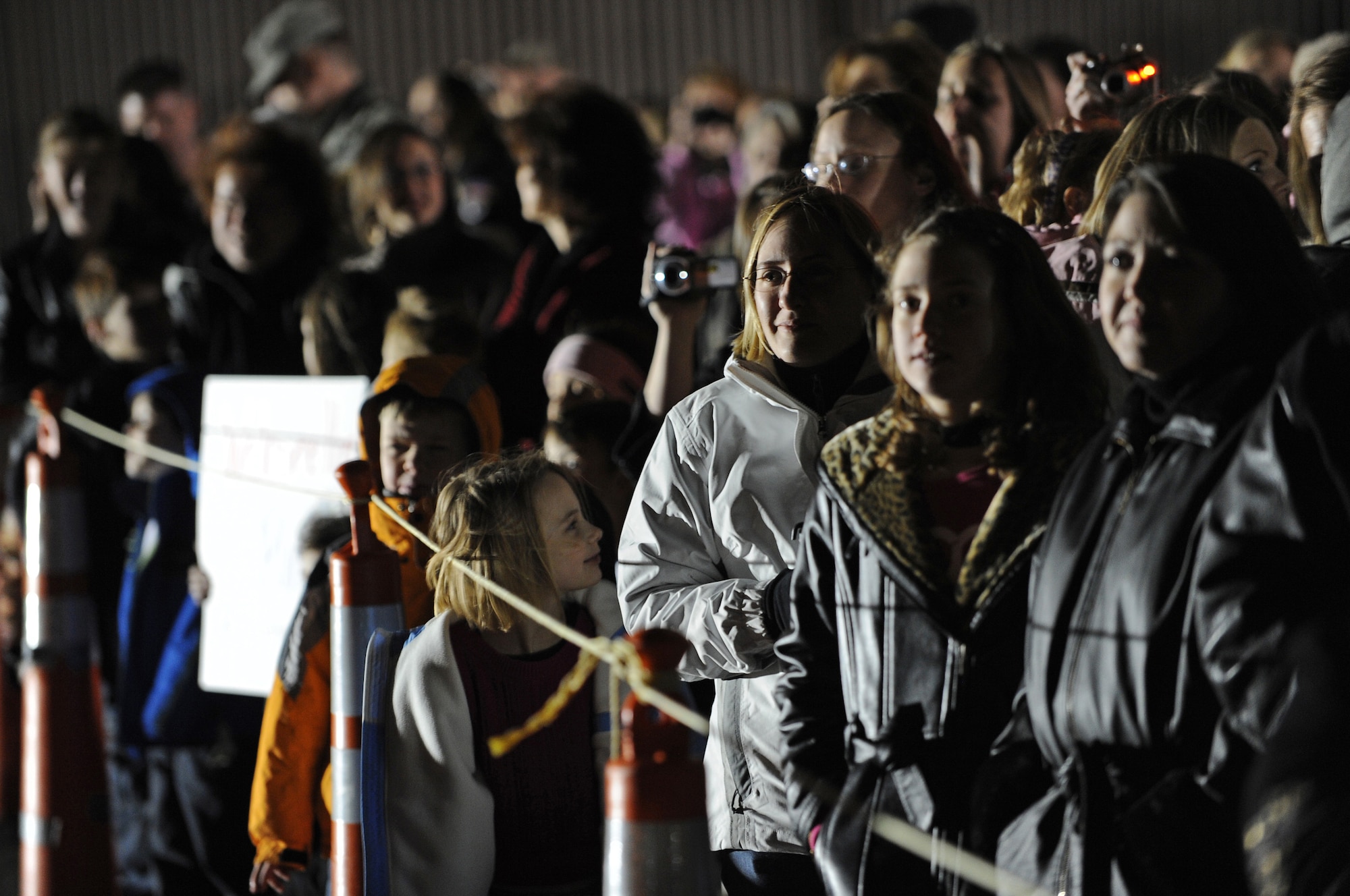 Family and friends of Ellsworth Airmen returning from deployment await their arrival here, January 31. Approximately 300 Airmen serving in various roles, deployed to support Operations Iraqi and Enduring Freedom. (U.S. Air Force photo/Senior Airman Marc I. Lane)