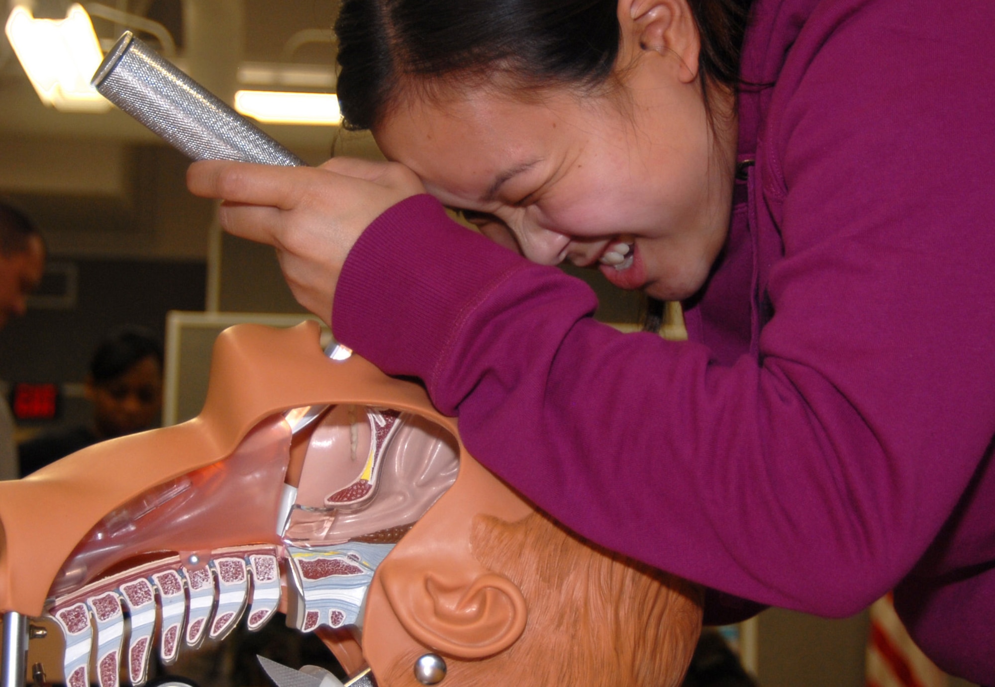 Senior Airman Donna Marie Yap, 95th Medical Operations Squadron paramedic ambulance service emergency medical technician, practice providing orotrachial intubation to a dummy during a Paramedic Refresher Course Jan. 22. (Air Force photo by Senior Airman Julius Delos Reyes)