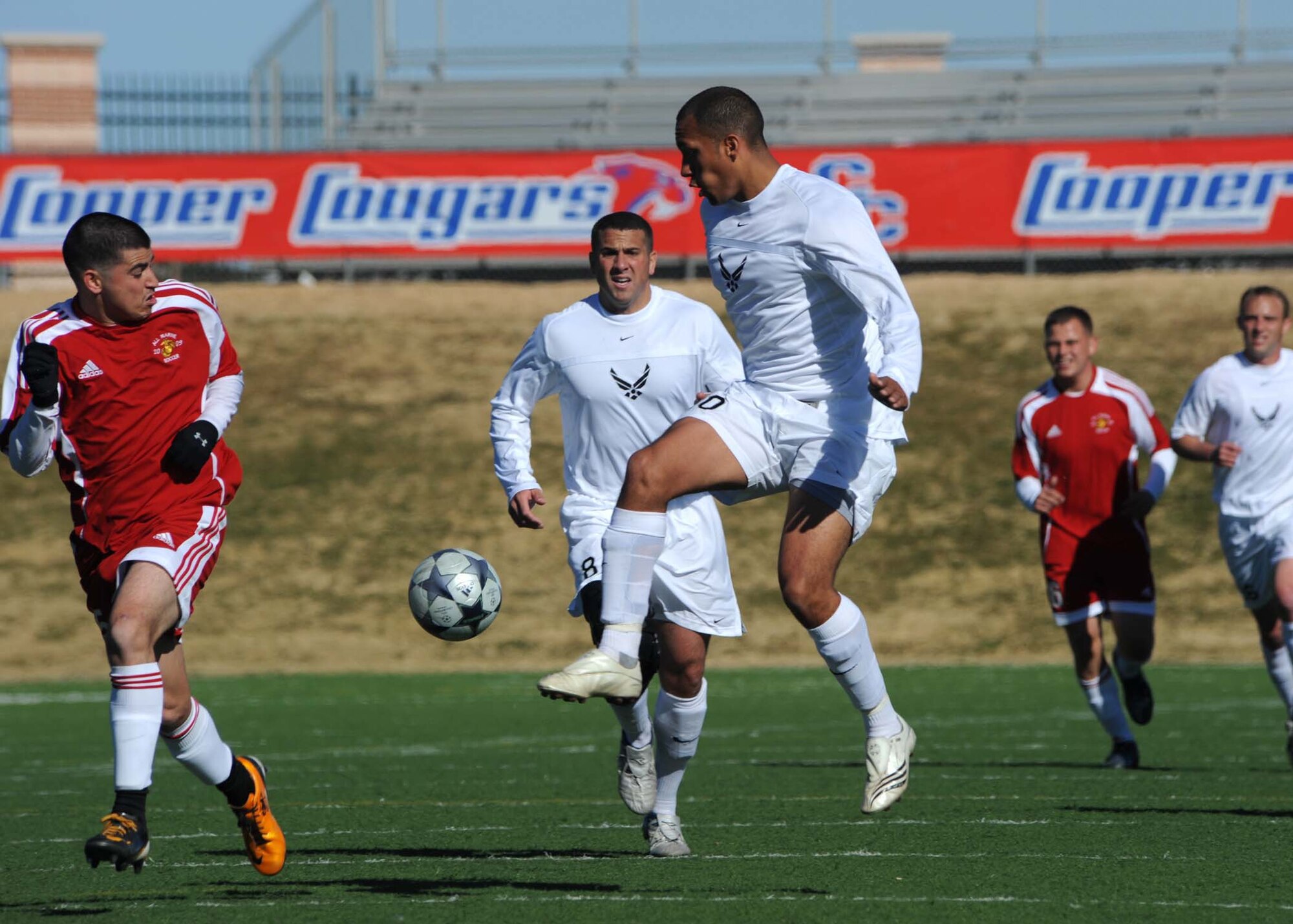 DYESS AIR FORCE BASE, Texas-- Air Force Senior Airman Peter Miller goes for the goal during a match against the U.S. Marine Corps at Shotwell Stadium, Feb. 3. The Air Force defeated the USMC 3-0. (U.S. Air Force photo by Airman 1st Class Stephen Reyes)