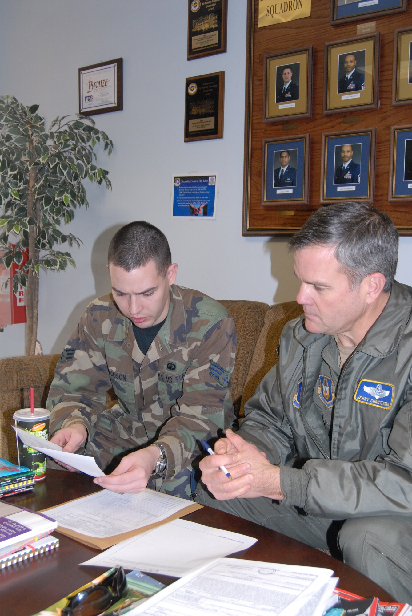 Senior Airman Michael Ferguson, 43rd Comptroller Squadron, aids Maj. Jerry Christensen with filling out a travel voucher. (U.S. Air Force Photo by Emily Farrington-Smith)