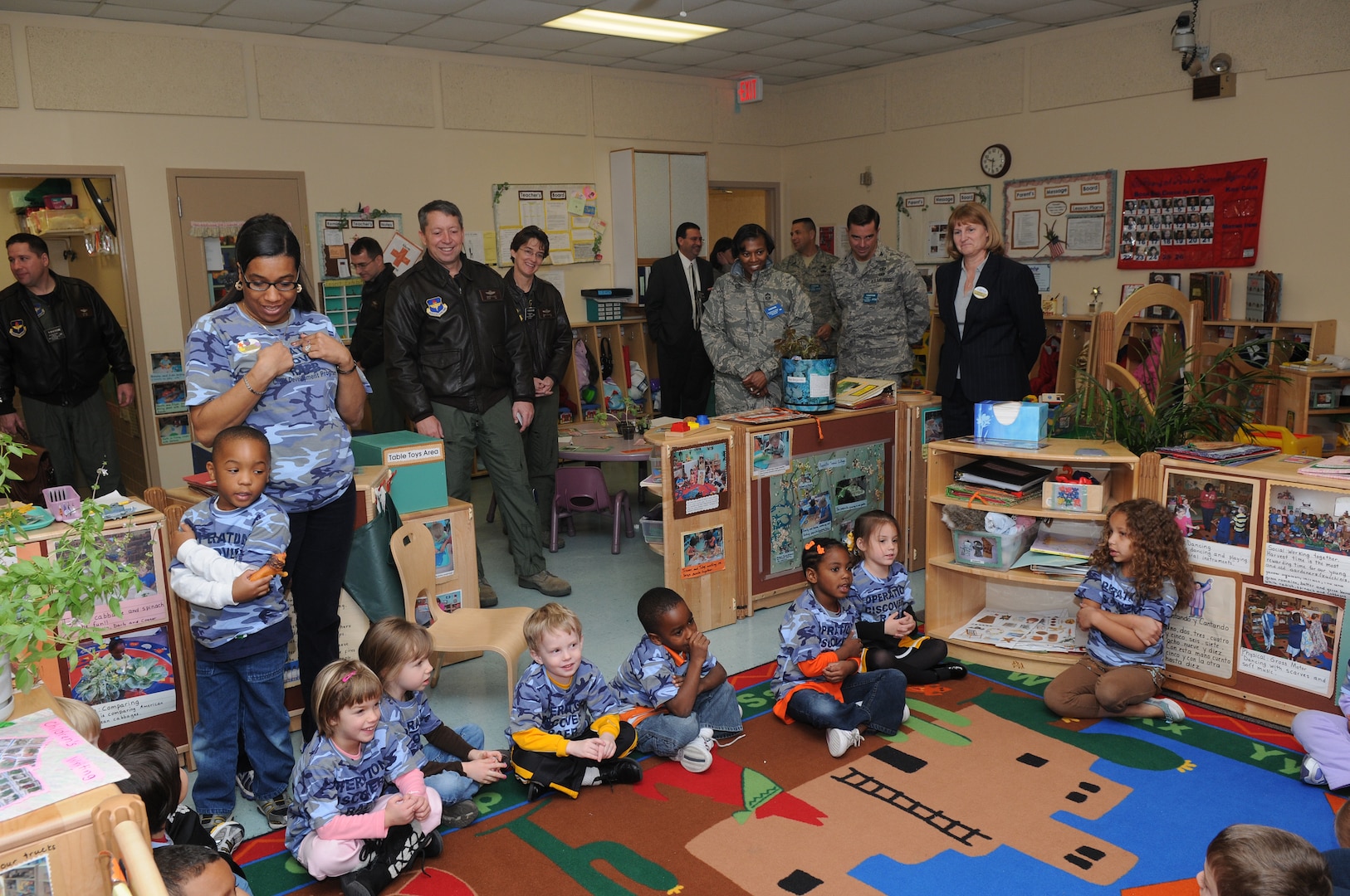 Maj. Gen. Gregory Feest, 19th Air Force commander, and Col. Jacqueline Van Ovost, 12th Flying Training Wing commander (left center), visit with staff and children at the child development center. General Feest visited several areas of the 12th Flying Training Wing Jan. 29-30 to learn more about the wing and its Airmen. (U.S. Air Force photo by Joel Martinez)