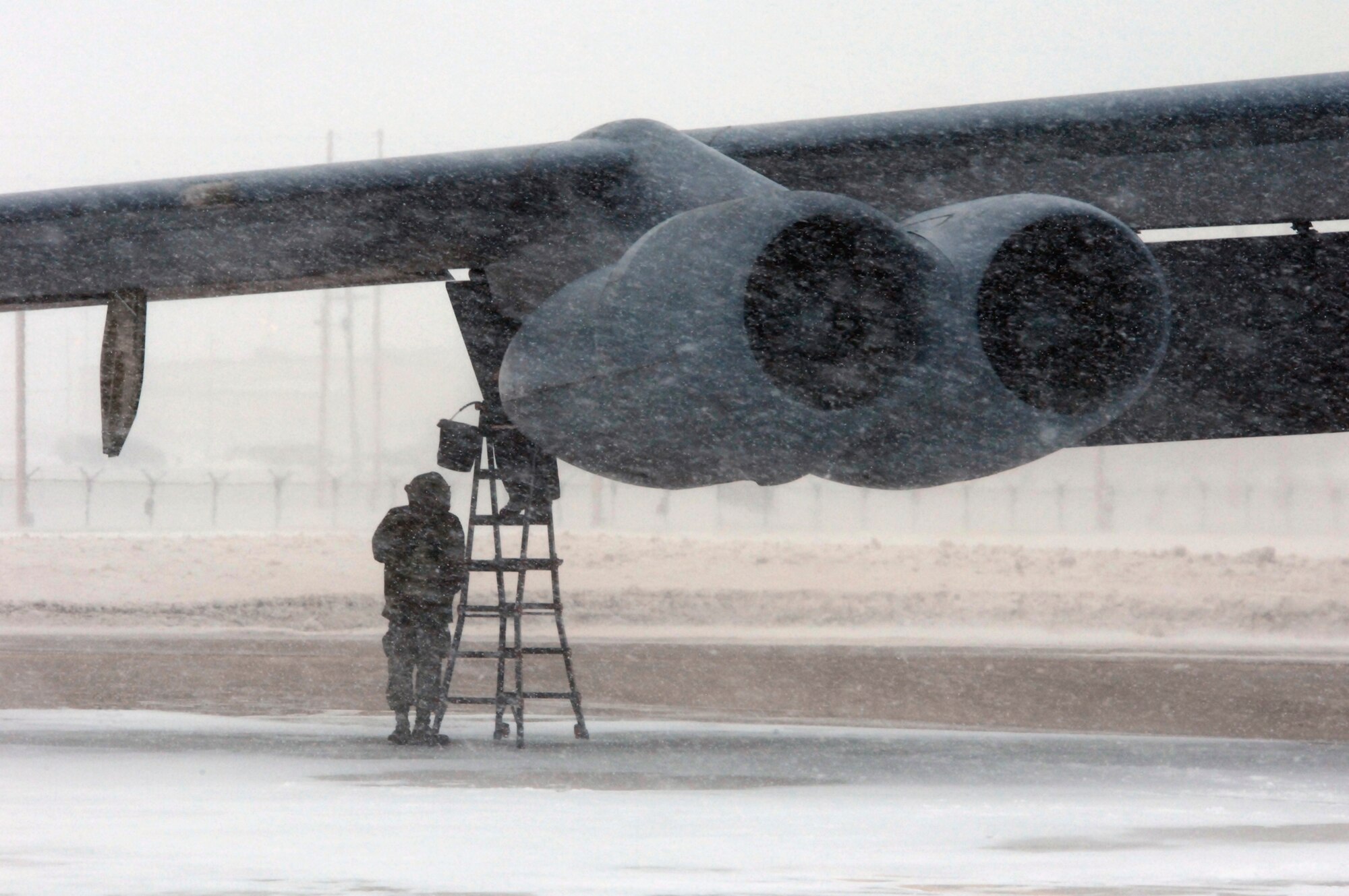 MINOT AIR FORCE BASE, N.D. – An unidentified crew chief and a maintenance technician from the 5th Aircraft Maintenance Squadron perform hydraulic pump checks on a B-52H Stratofortress during a recent Bomber Strategic Aircraft Regeneration Team (BSART) exercise here Jan. 28.  The BSART exercise involves more than 250 personnel who are forward deployed to an undisclosed location to set up an alternative deterrent base to service and refit aircraft for future strike missions. (U.S. Air Force photo by Staff Sgt. Keith Ballard)