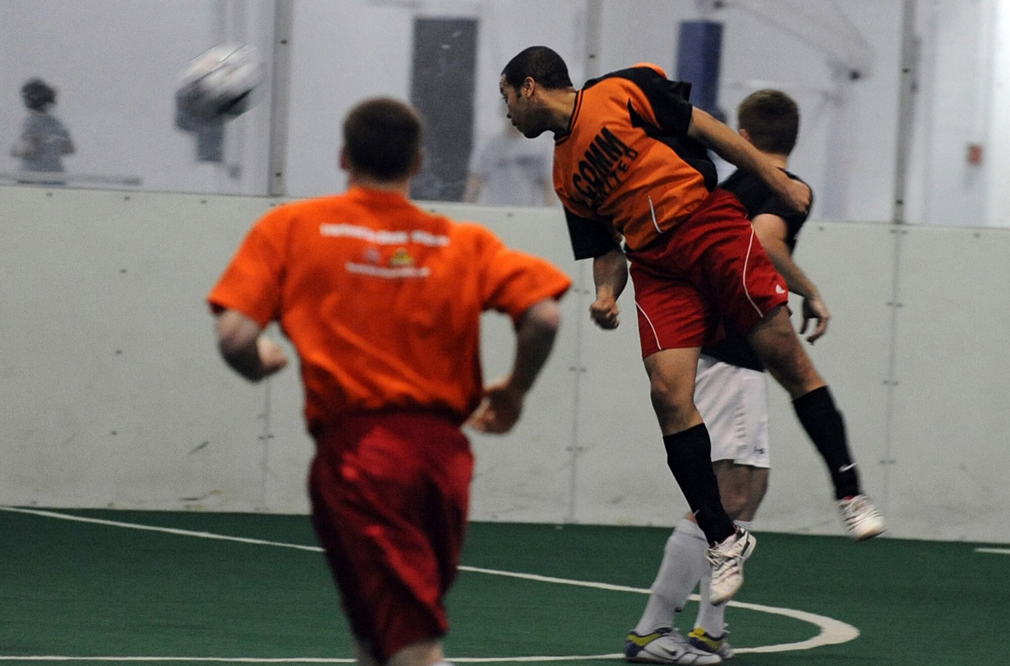 OFFUTT AIR FORCE BASE, Neb. -- Bryan Richardson, 55th Communications Group, flicks a header towards goal during the intramural soccer championship game held at the Offutt Field House, Feb. 2. The intramural soccer league ended with  U.S. Strategic Command defeating the 55th CG 4-1.

U.S. Air Force Photo by Josh Plueger
