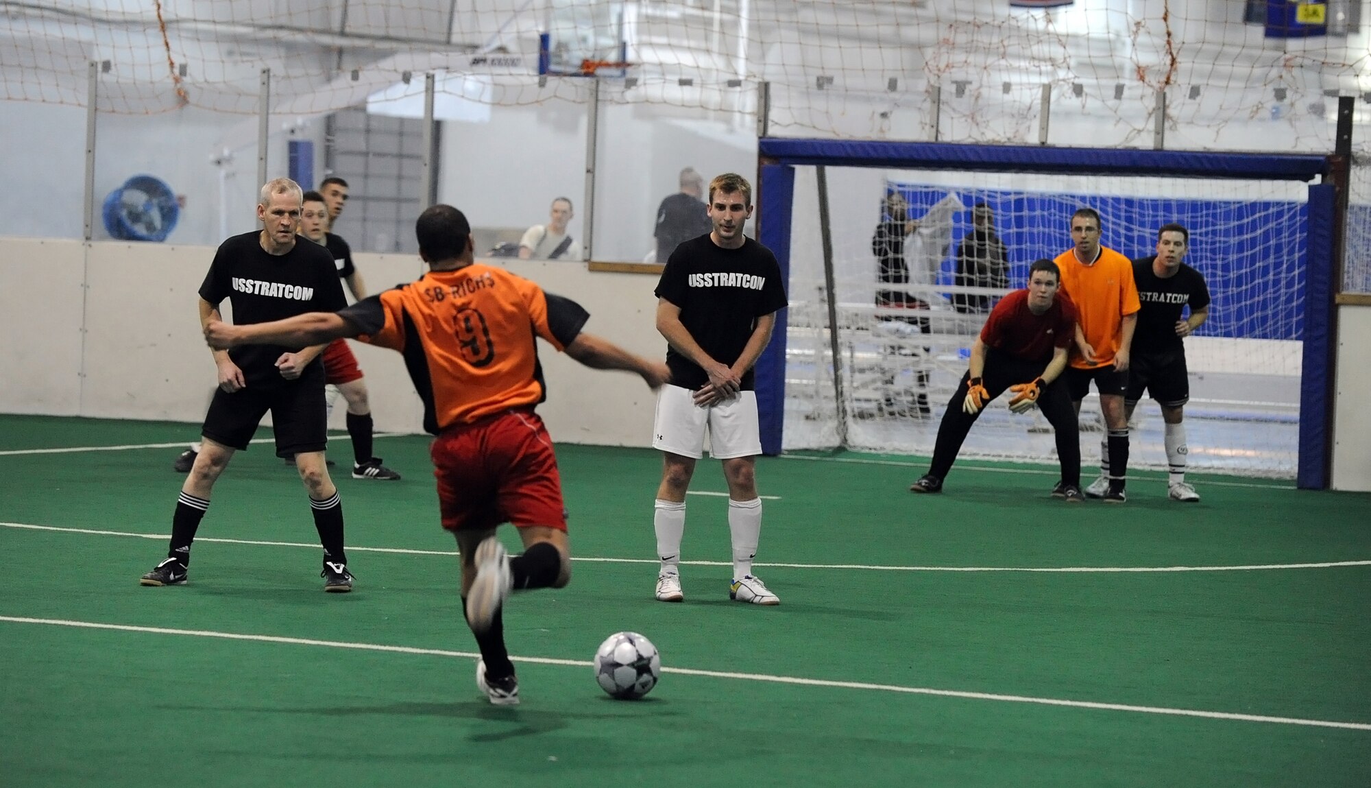 OFFUTT AIR FORCE BASE, Neb. -- Bryan Richardson, 55th Communications Group, takes a direct free kick during the intramural soccer championship game held at the Offutt Field House, Feb. 2.  The intramural soccer league ended with  U.S. Straegic Command defeating the 55th CG 4-1.

U.S. Air Force Photo by Josh Plueger
