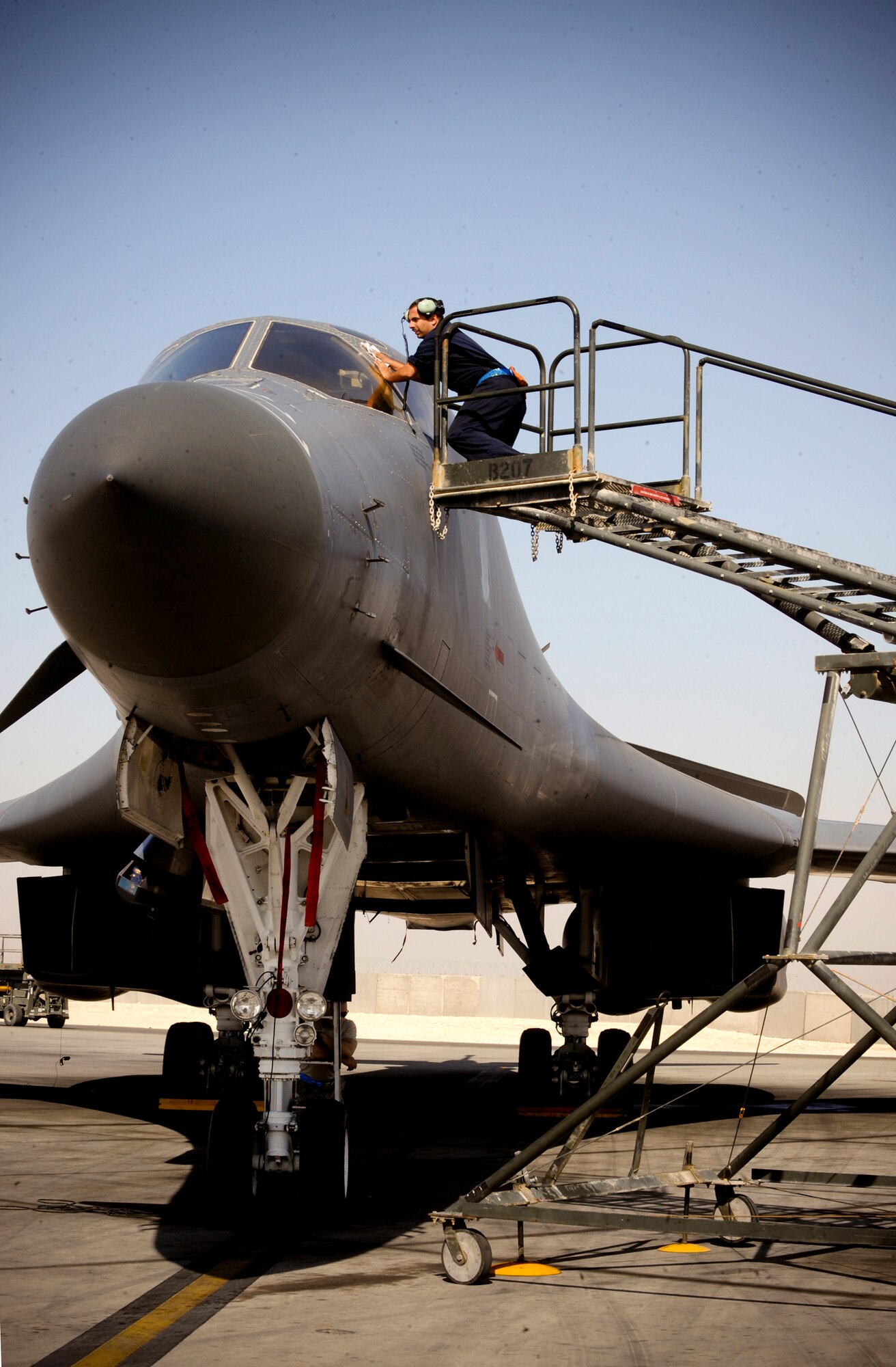 Staff Sgt. Trevor Helm washes the windshield of a B-1B Lancer prior to a mission Jan. 29 at an air base in Southwest Asia. The windows require a special solvent to clean them due to the material used in its creation. Sergeant Helm is a crew chief for the 7th Aircraft Maintenance Unit deployed from Dyess Air Force Base, Texas. He is a native of Lisbon, Maine. (U.S. Air Force photo/Staff Sgt. Joshua Garcia) 
