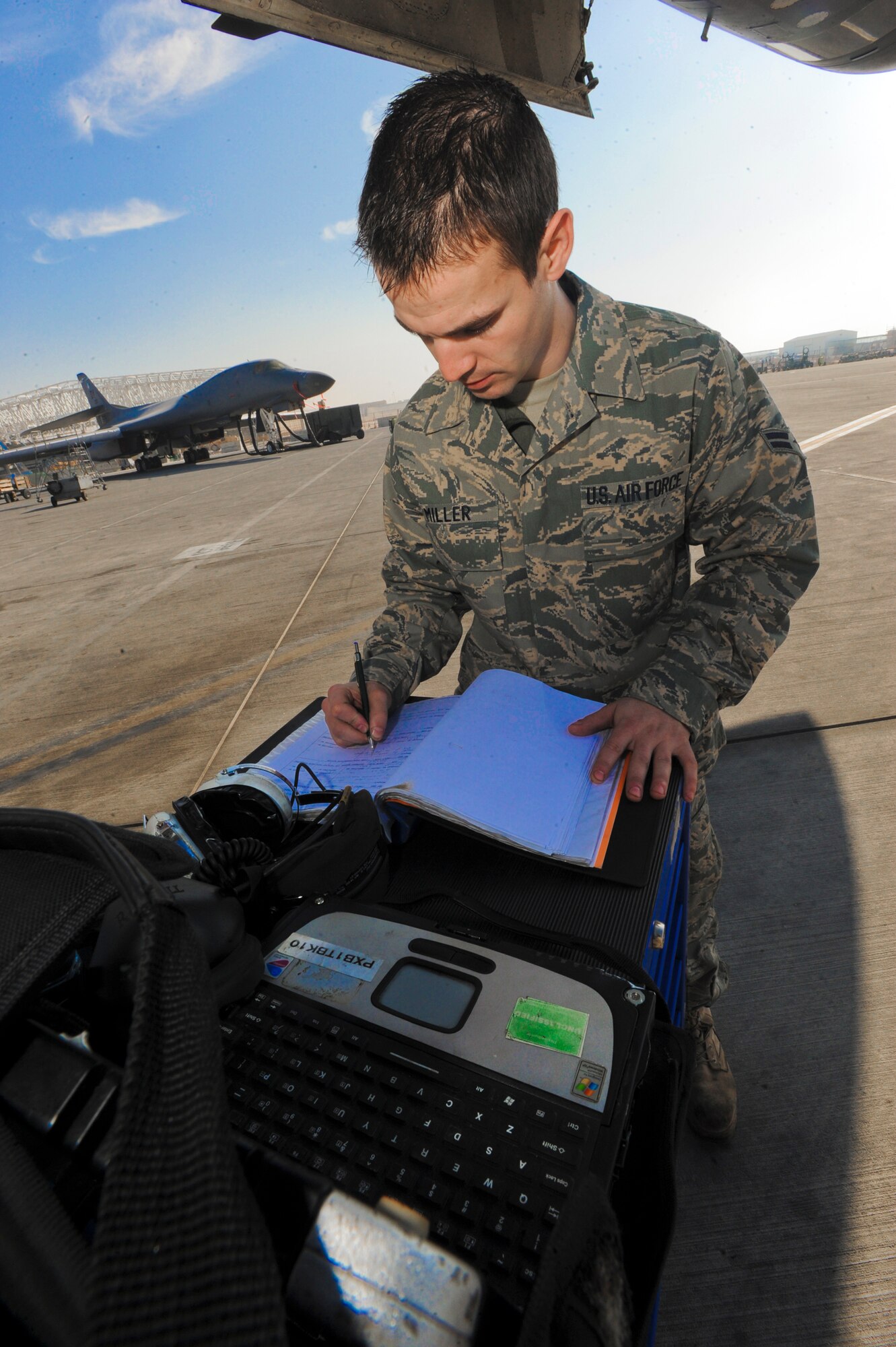 Airman 1st Class Ancel Miller fills out maintenance paperwork after completing work on a B-1B Lancer Jan. 29 at an air base in Southwest Asia. Airman Miller is an electrical and environmental technician for the 7th Aircraft Maintenance Unit deployed from Dyess Air Force Base, Texas. He hails from Orange, Texas. (U.S. Air Force photo/ Staff Sgt. Joshua Garcia) 
