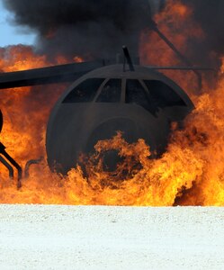 A fire roars on a mock aircraft at Randolph Air Force Base during a training session on Feb. 1. Several local fire departments visited Randolph to train on proper response procedures to downed 12th Flying Training Wing aircraft in the event one crashed in their city. (U.S. Air Force photo by Steve White)