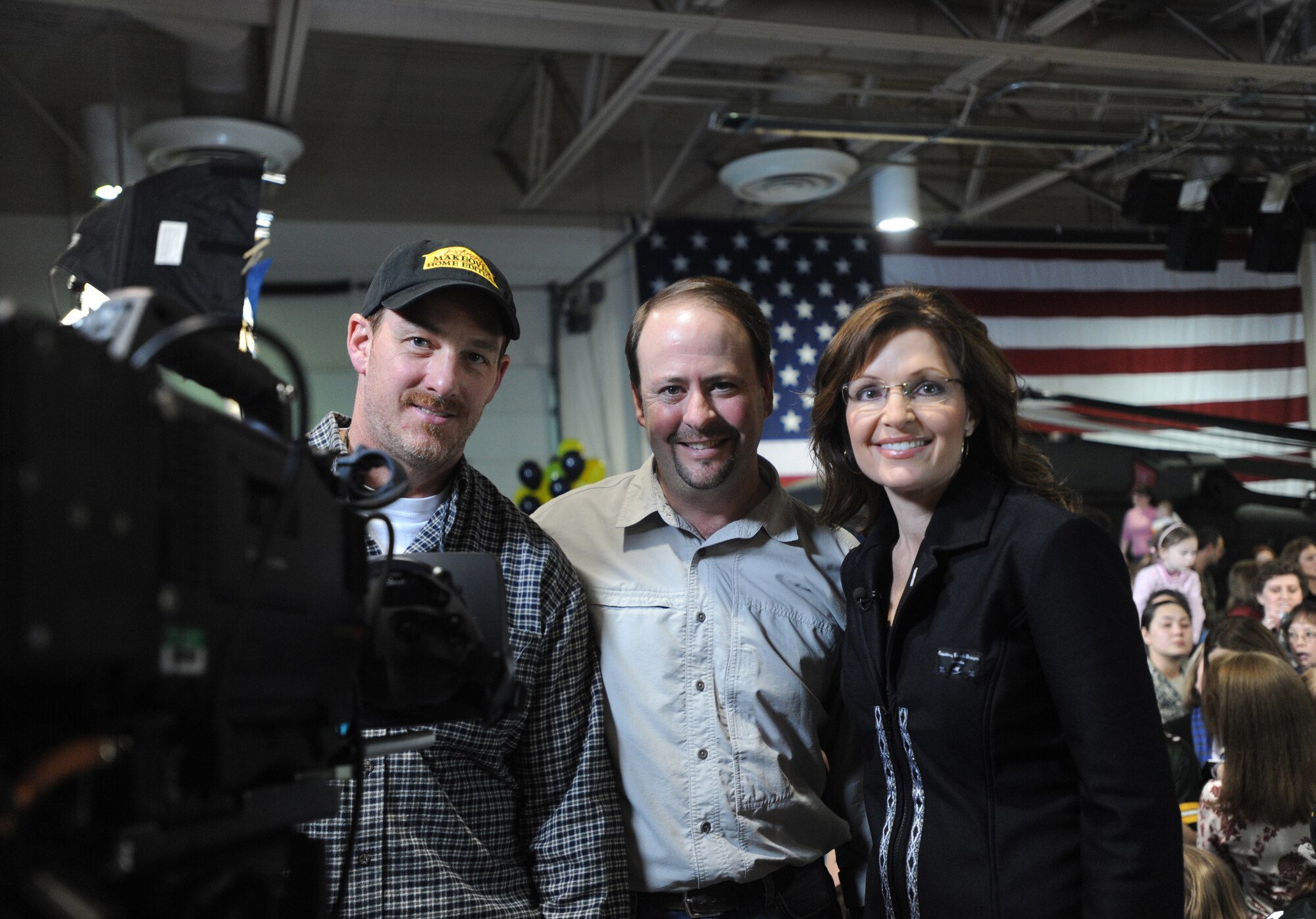 FORT RICHARDSON, Alaska-- Alaska Governor Sarah Palin poses with Jeff Hoien (left) and Geoff Nelson of the Seattle NBC television crew, who filmed the commercial she shot for the Superbowl Jan. 25, 2009. Gov. Palin was highlighting the importance of family and the military in the United States. (U.S. Air Force photo/Airman First Class Kristin High) 
