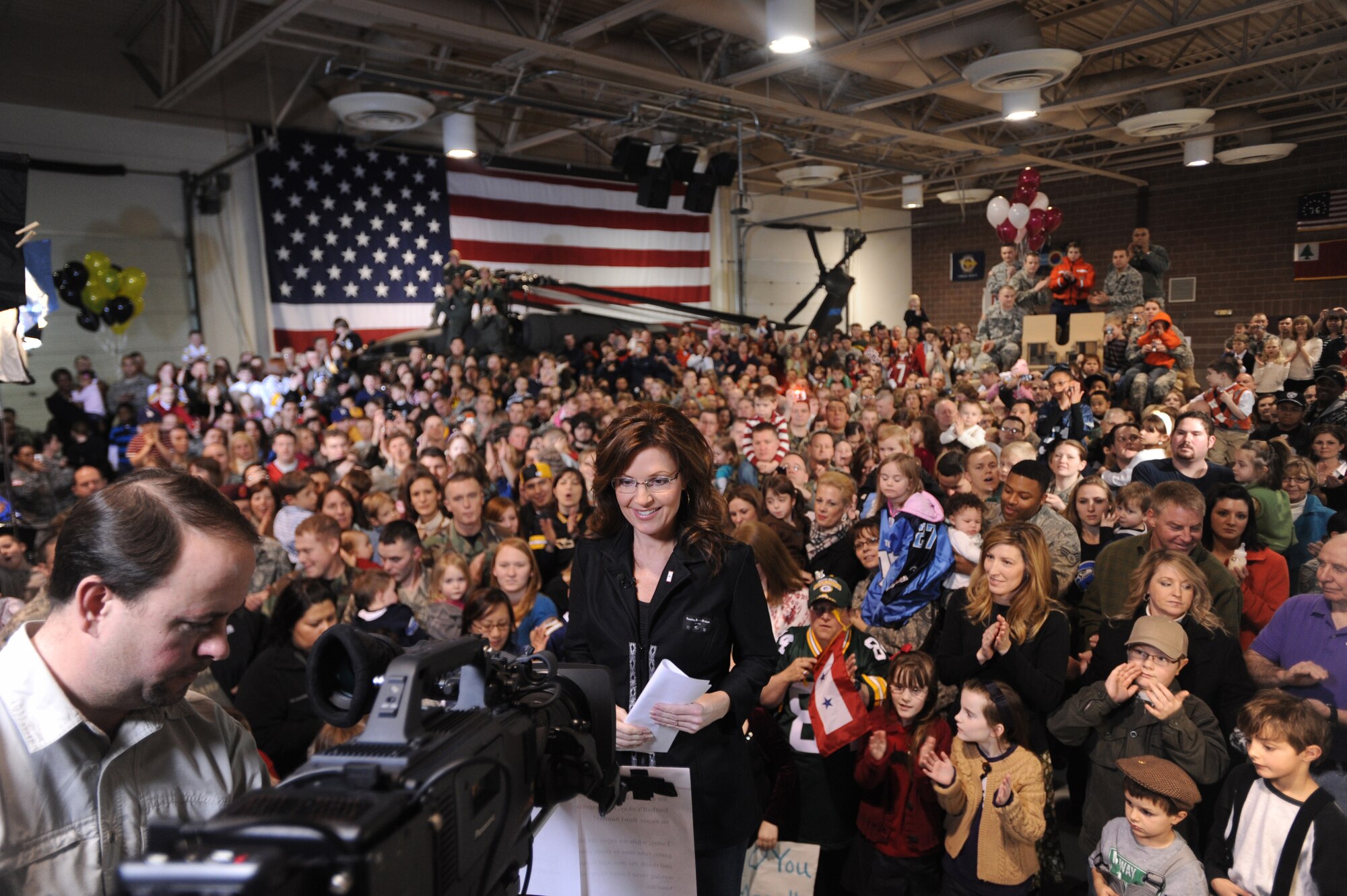 FORT RICHARDSON, Alaska -- Alaska Governor Sarah Palin prepares for her Superbowl commercial Jan. 25, 2009. Gov. Palin was highlighting the importance of family and the military in the United States.  Members of the 477th Fighter Group were in the audience representing Air Force Reserve in Alaska.  The 477th Fighter Group is Air Force Reserve Command's first F-22A Raptor unit.  The 477th Fighter Group is a Classic Associate unit responsible for recruiting, training, developing and retaining unrivaled Citizen Airmen.  (U.S. Air Force photo/Airman First Class Kristin High)