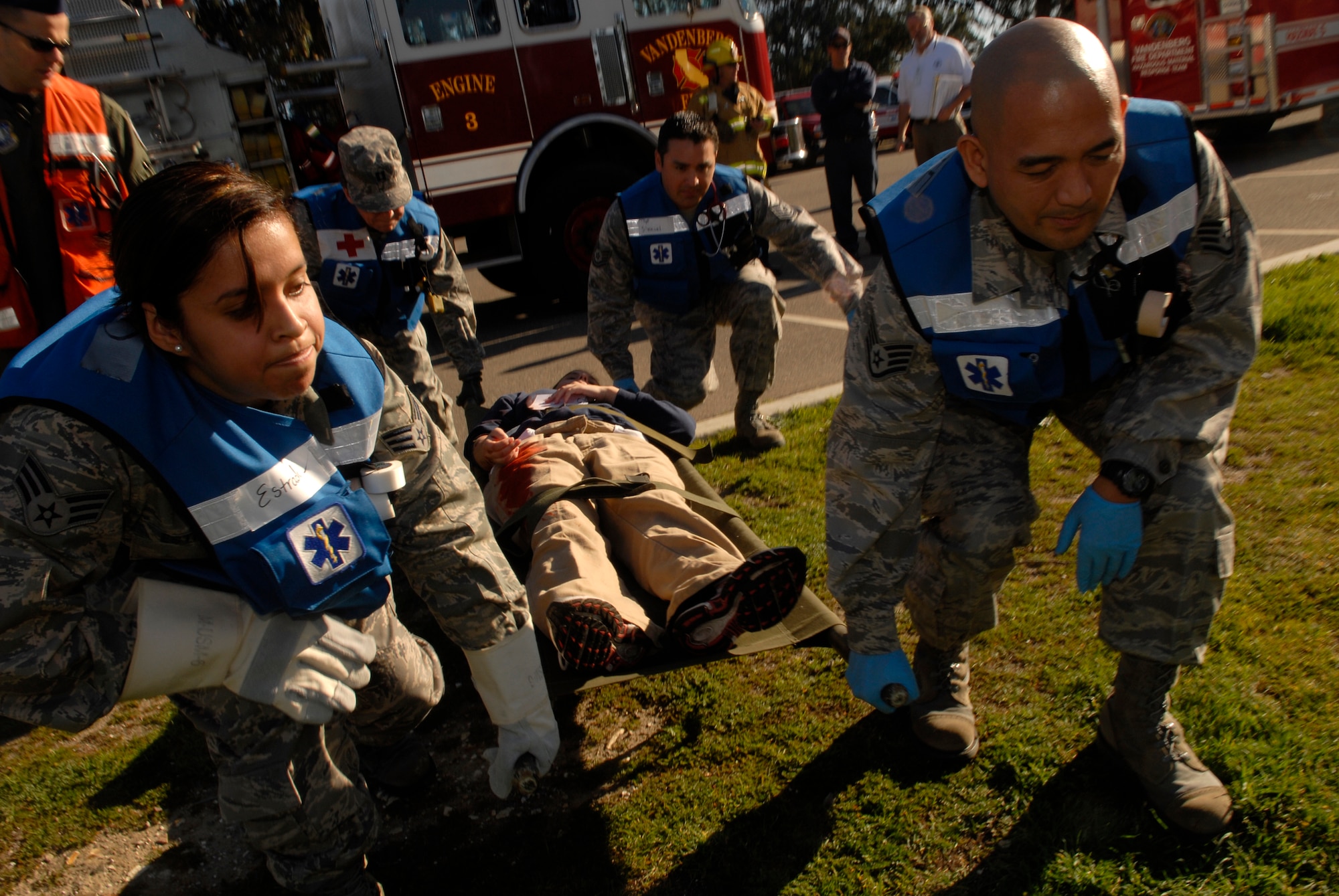 VANDENBERG AIR FORCE BASE, Calif. -- Airmen from the 30th Medical Group move an injured patient using a stretcher during the Medical Emergency Response Capabilities Assessment and Training exercise Jan. 29 here. The MERCAT is a training and exercise program designed to enhance the ability of Air Force Space Command Home Station Medical Response Teams to respond to chemical, biological, radiological or nuclear events. (U.S. Air Force photo/Senior Airman Christian Thomas)