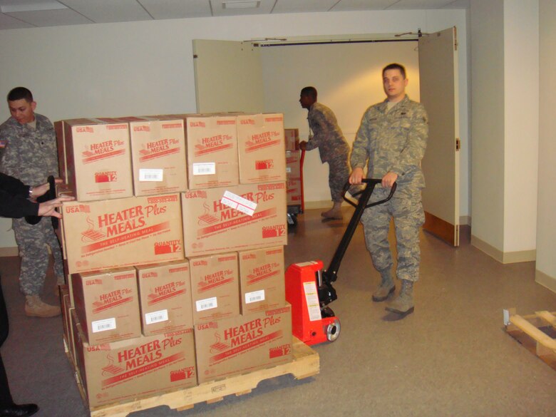 Airman 1st Class Kevin Rucker, a shift leader at the Tradewinds Flight Kitchen, moves meals for personnel supporting the Presidential Inauguration Jan. 20. (courtesy photo)                               