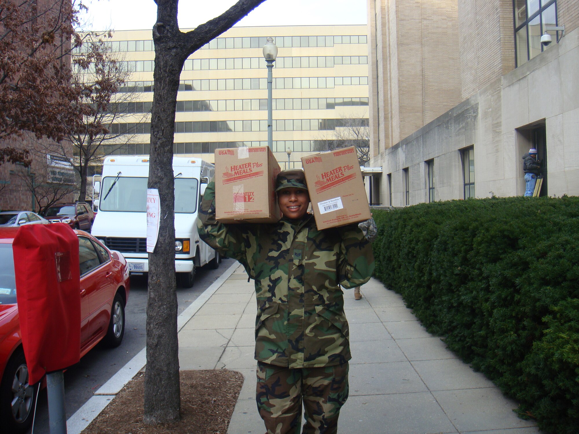 Staff Sgt. Angela Grady, a shift leader at the Breeze Dining Facility, carries heater meals for personnel supporting the Presidential Inauguration Jan. 20. (courtesy photo)                                