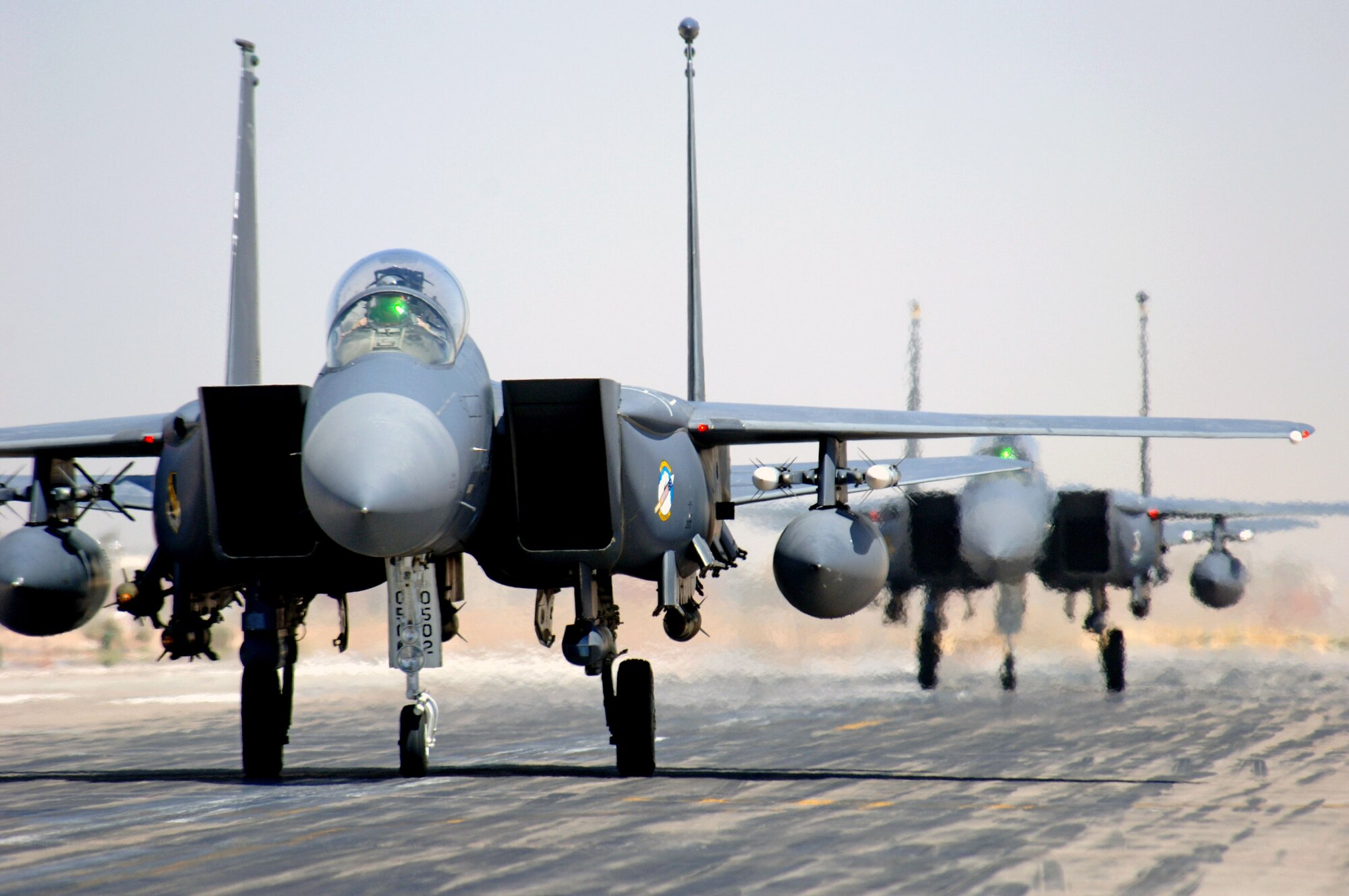F-15E Strike Eagles taxi in at Joint Base Balad, Iraq, after an Operation Iraqi Freedom mission. The F-15E is a dual-role fighter designed to perform air-to-air and air-to-ground missions as well as provide armed aerial overwatch. The fighters are deployed from Seymour Johnson Air Force Base, N.C. (U.S. Air Force photo/Staff Sgt. Tony R. Tolley)