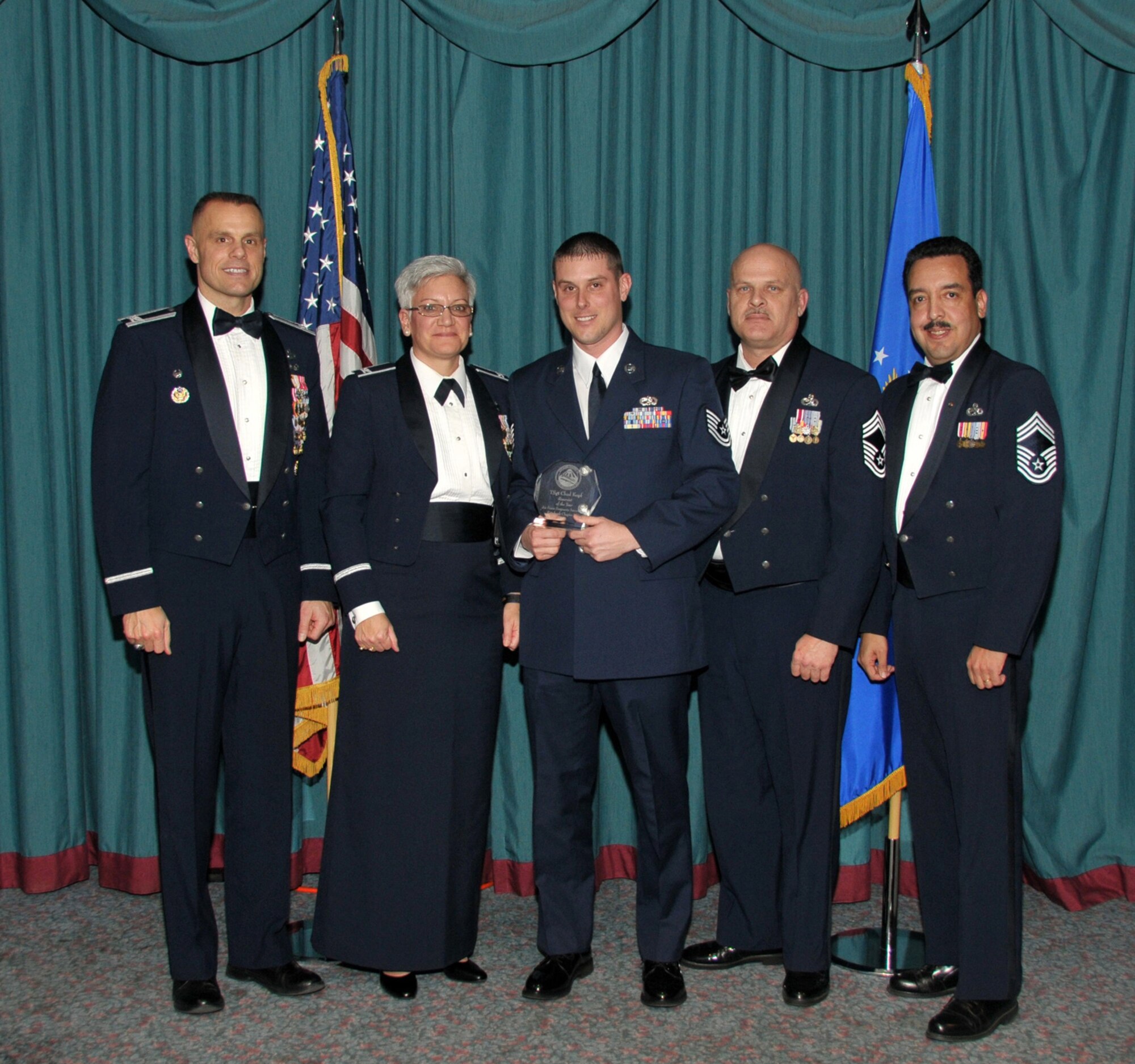 WRIGHT-PATTERSON AFB, Ohio - Tech. Sgt. Chad Kopf, 445th Aircraft Maintenance Squadron, (center) is the Air Force Sergeants Association Reserve Member of the Year. Sergeant Kopf was presented his award at the AFSA annual awards banquet Jan. 24, 2009 for outstanding contributions both on and off duty.  Also pictured from left to right are Col. Brad Spacy, 88th Air Base Wing commander, Col. Anna Schulte, 445th Maintenance Group commander; Chief Master Sgt. Robert Bowen, 445th Aircraft Maintenace Squadron, and retired Chief Master Sgt. Ruben Garcia, President, AFSA Chapter 751. (Courtesy photo/Bill Richards)  