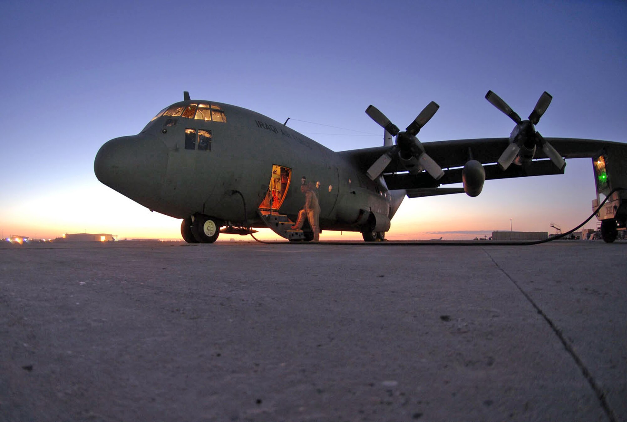 Master Sgt. Louis Carter performs a preflight inspection on an Iraqi C-130E Feb. 2 at Sather Air Base, Iraq. The C-130 was one of two aircraft on its way to pick up Iraqi election ballot boxes. Sergeant Carter is a 321st Air Expeditionary Airlift Squadron combat aviation adviser deployed from the 550th Special Operations Squadron at Kirtland Air Force Base, N.M. (U.S. Air Force photo/Staff Sgt. Tim Beckham) 
