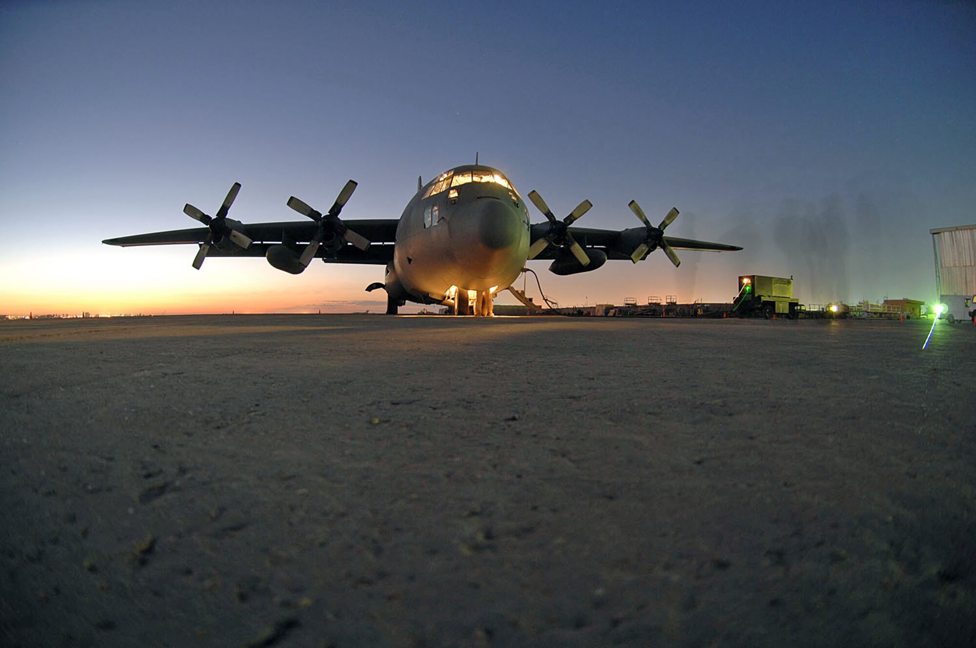 Master Sgt. Louis Carter performs a preflight inspection on an Iraqi C-130E Feb. 2 at Sather Air Base, Iraq. The C-130 was one of two aircraft on its way to pick up Iraqi election ballot boxes. Sergeant Carter is a 321st Air Expeditionary Airlift Squadron combat aviation adviser deployed from the 550th Special Operations Squadron at Kirtland Air Force Base, N.M. (U.S. Air Force photo/Staff Sgt. Tim Beckham) 
