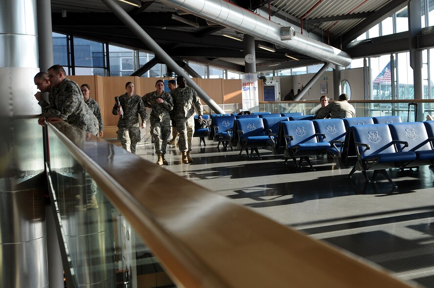 Air Force and Army personnel wait in the passenger area of the Ramstein Air Base Passenger Terminal before departing to the Area of Operation Jan. 26, 2009. The Ramstein PAX terminal, operated by the 721st Aerial Port Squadron, is the only one of its kind in Europe and is the pit stop point for most troops headed downrange.  (U.S. Air Force photo by Airman 1st Class Kenny Holston) 