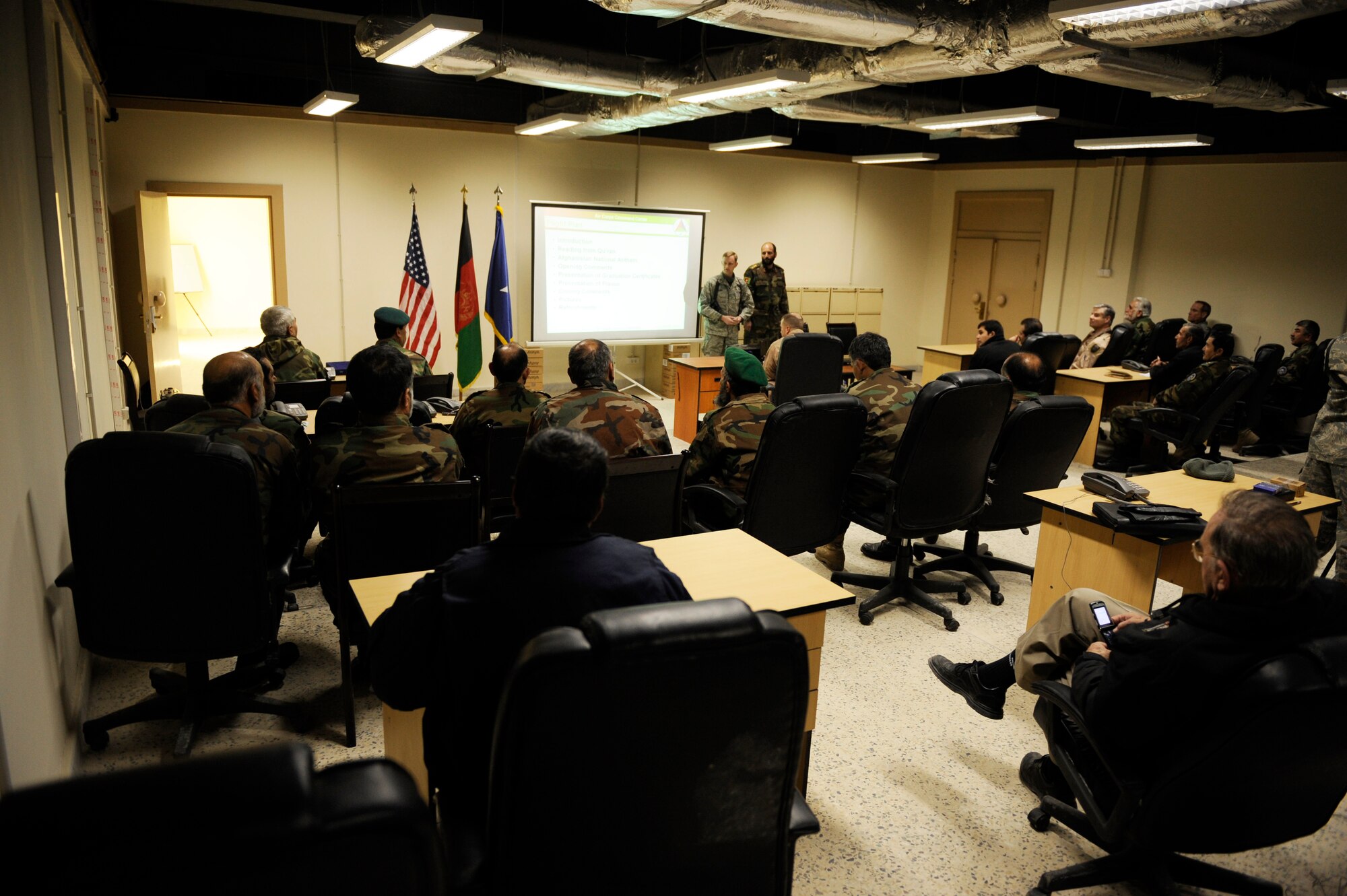 Members of the Afghan Army Air Corps. sit through a graduation ceremony for the first ever Afghan Command and Control Center Course on January 24, 2009 in Kabul, Afghanistan.  The command and control course is four weeks long and graduated 16 members.  (U.S. Air Force photo by Staff Sgt. James L. Harper Jr.) 
