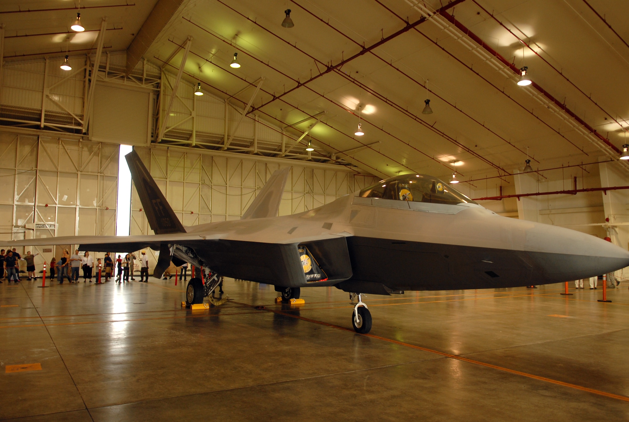 An F-22A Raptor sits on display Jan. 30, 2009 at Kadena Air Base, Japan. The 18th Wing and the 27th Expeditionary Fighter Squadron hosted "Meet the Raptor Day" Jan. 30 to allow military members, Japanese employees and their families an opportunity to see the F-22A up close, talk to pilots and maintainers and learn more about the Raptors' mission in the Pacific. 12 F-22As and about 250 personnel are deployed here from Langley for a three month rotation in support of U.S. Pacific Command obligations in the western Pacific. (US Air Force photo/Junko Kinjo)